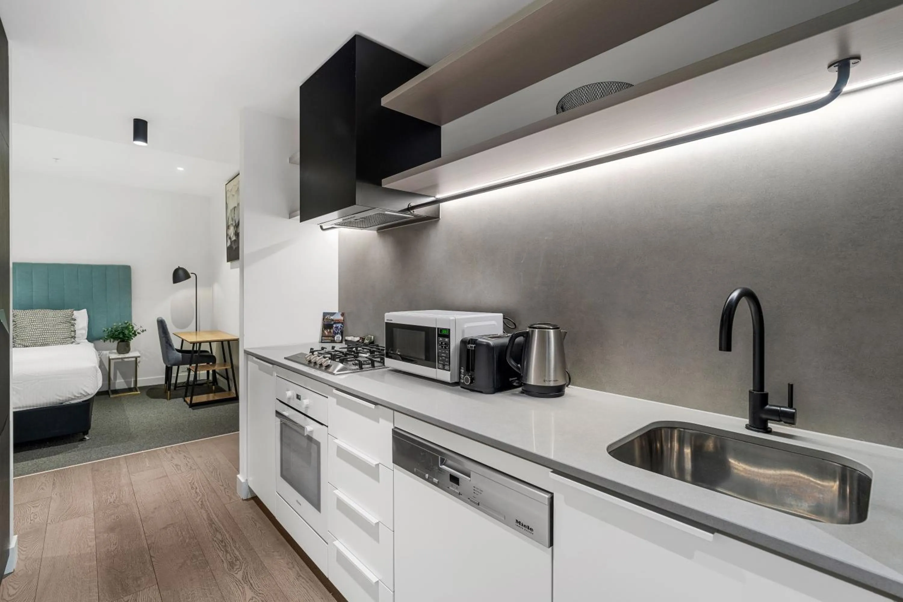 Kitchen or kitchenette, Bed in The Eminence Apartments by CLLIX