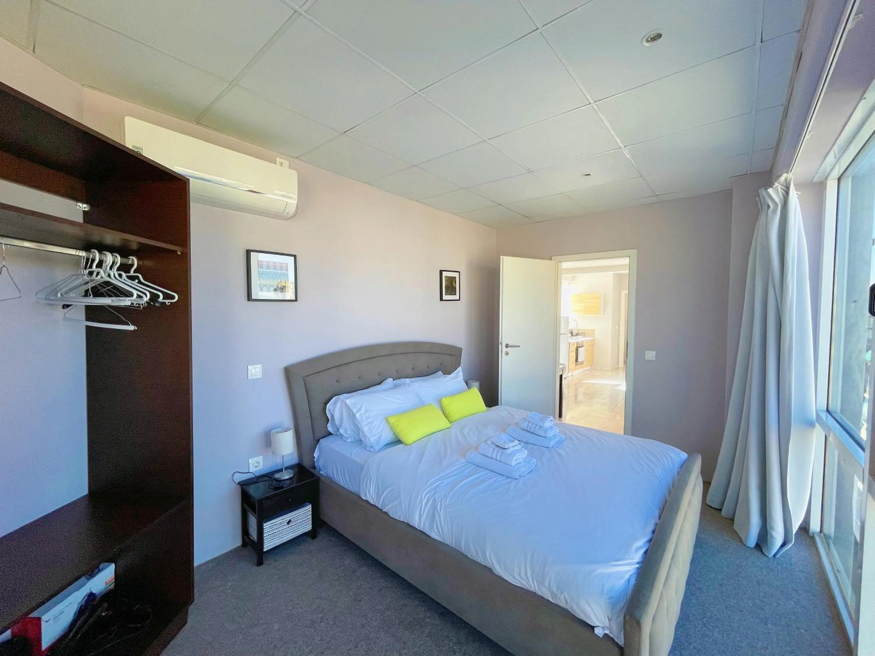 Bed in WSD Baia Acropolis Hotel Apartment