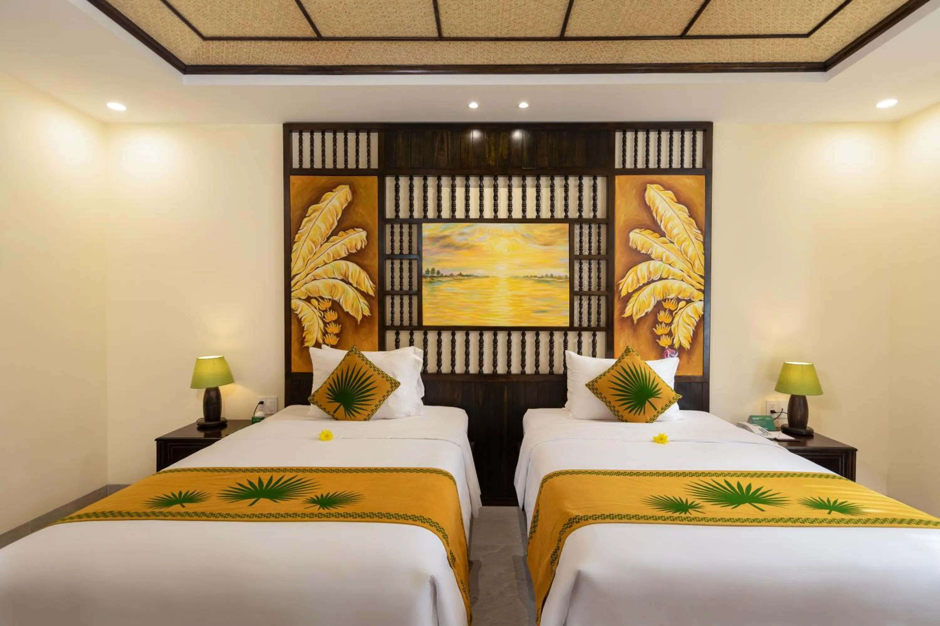 Bed in Palm Garden Beach Resort & Spa