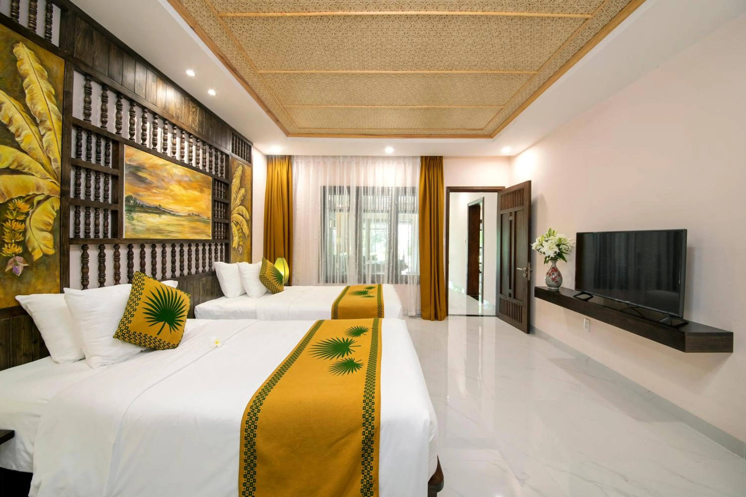 Bed in Palm Garden Beach Resort & Spa