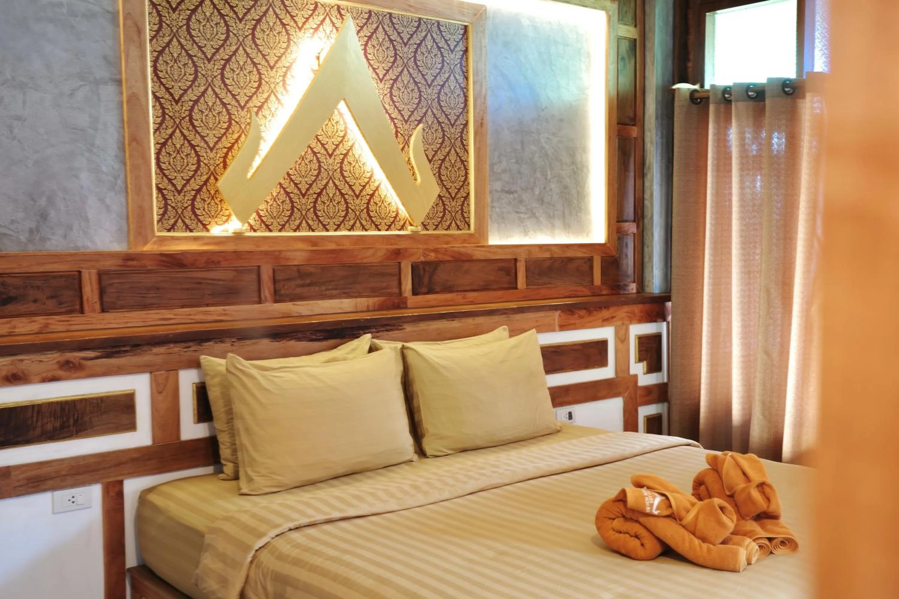 Bed in Phi Phi Relax Beach Resort