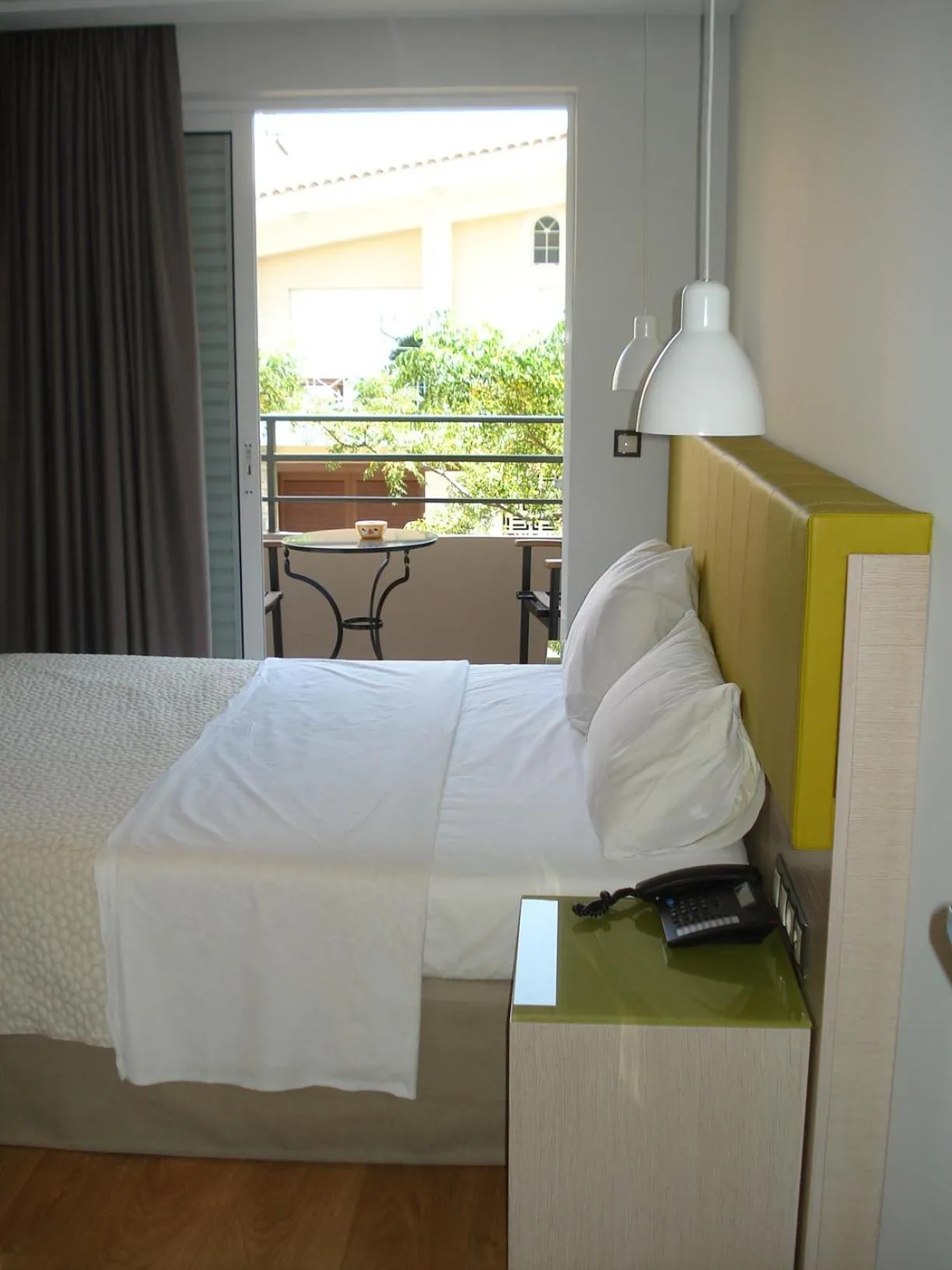 Bed in Elements Rooms & Apartments