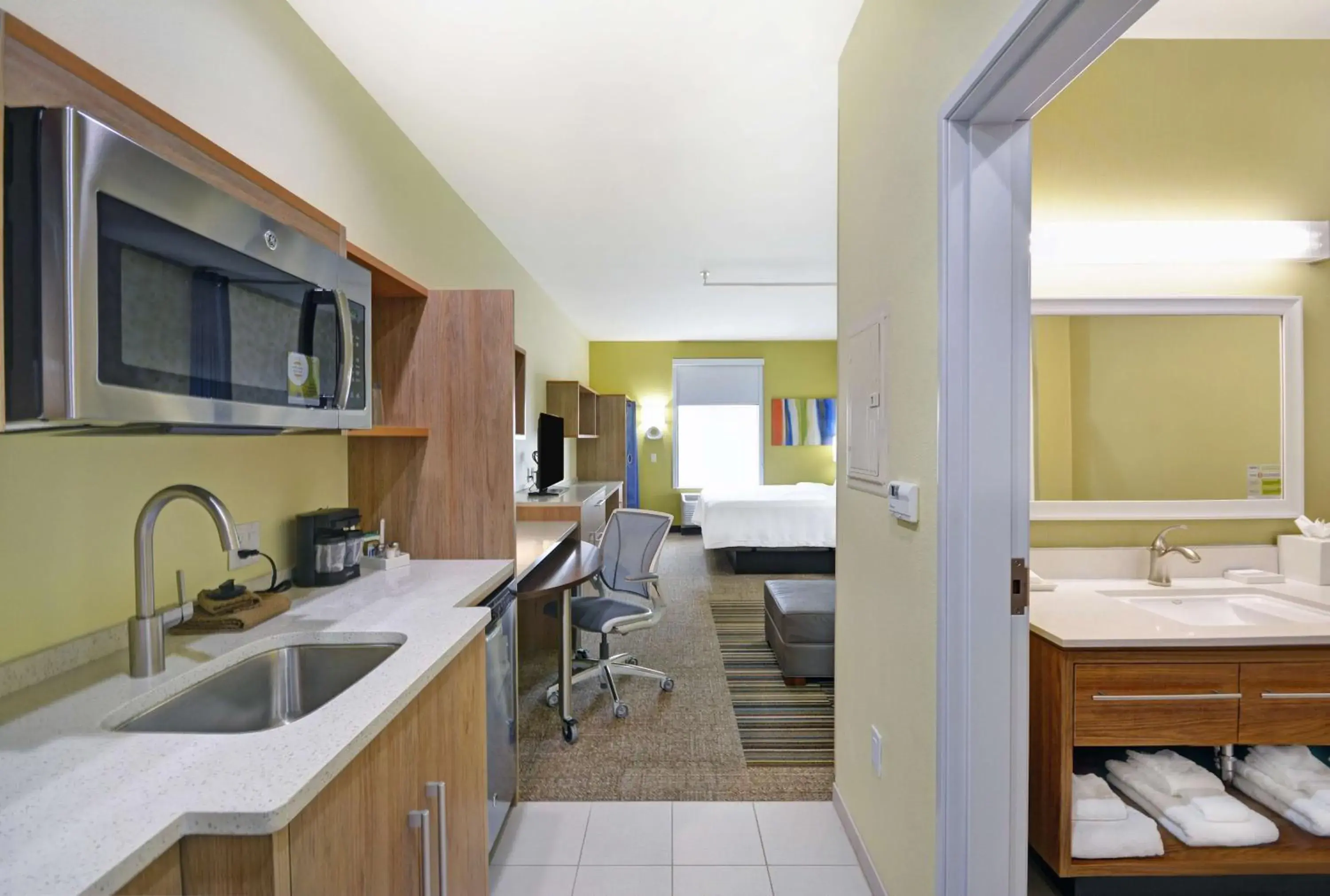 Bedroom, Kitchen/Kitchenette in Home2 Suites By Hilton Dallas Desoto