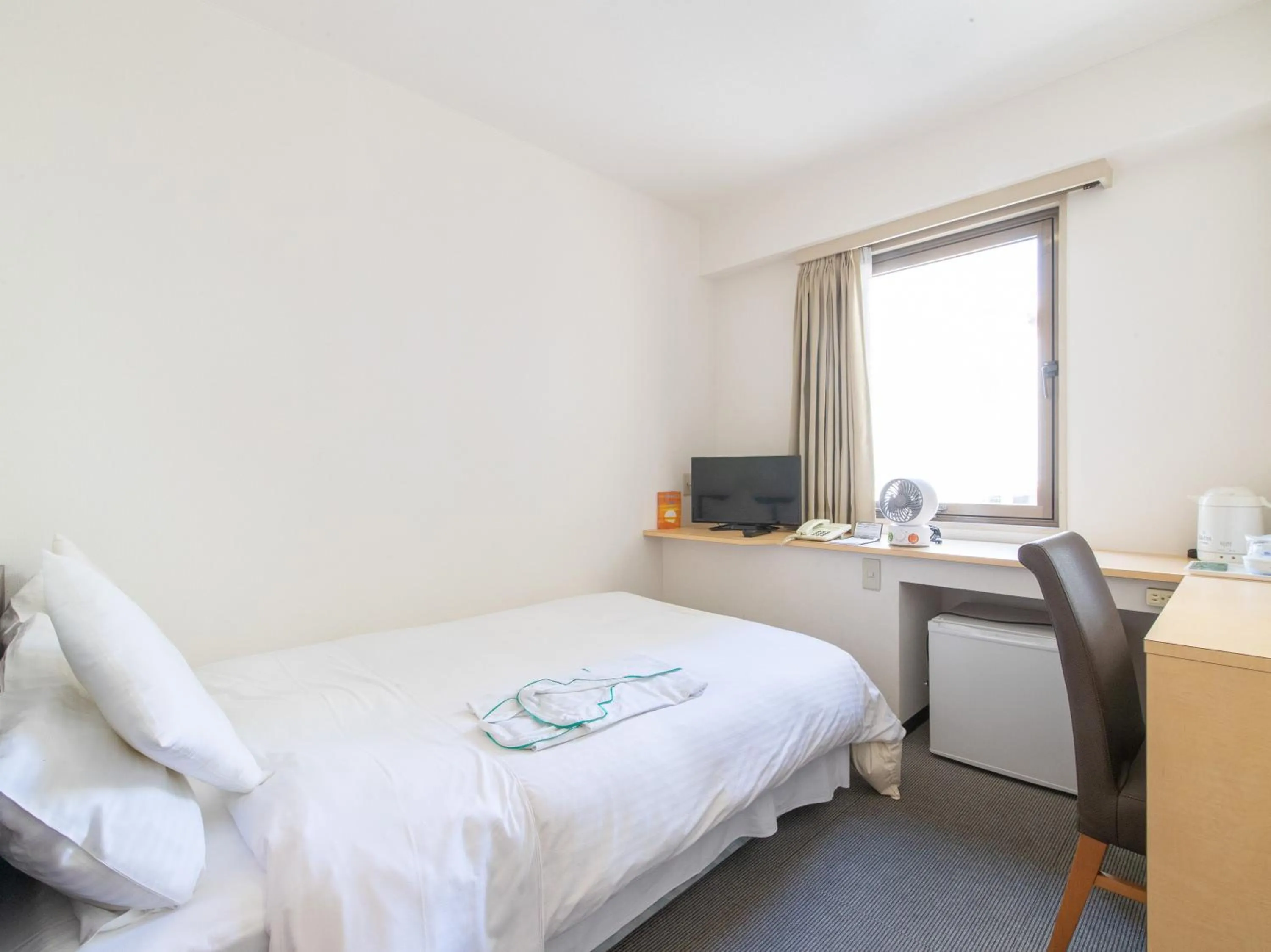 Bed in Tabist Sasebo Palace Hotel