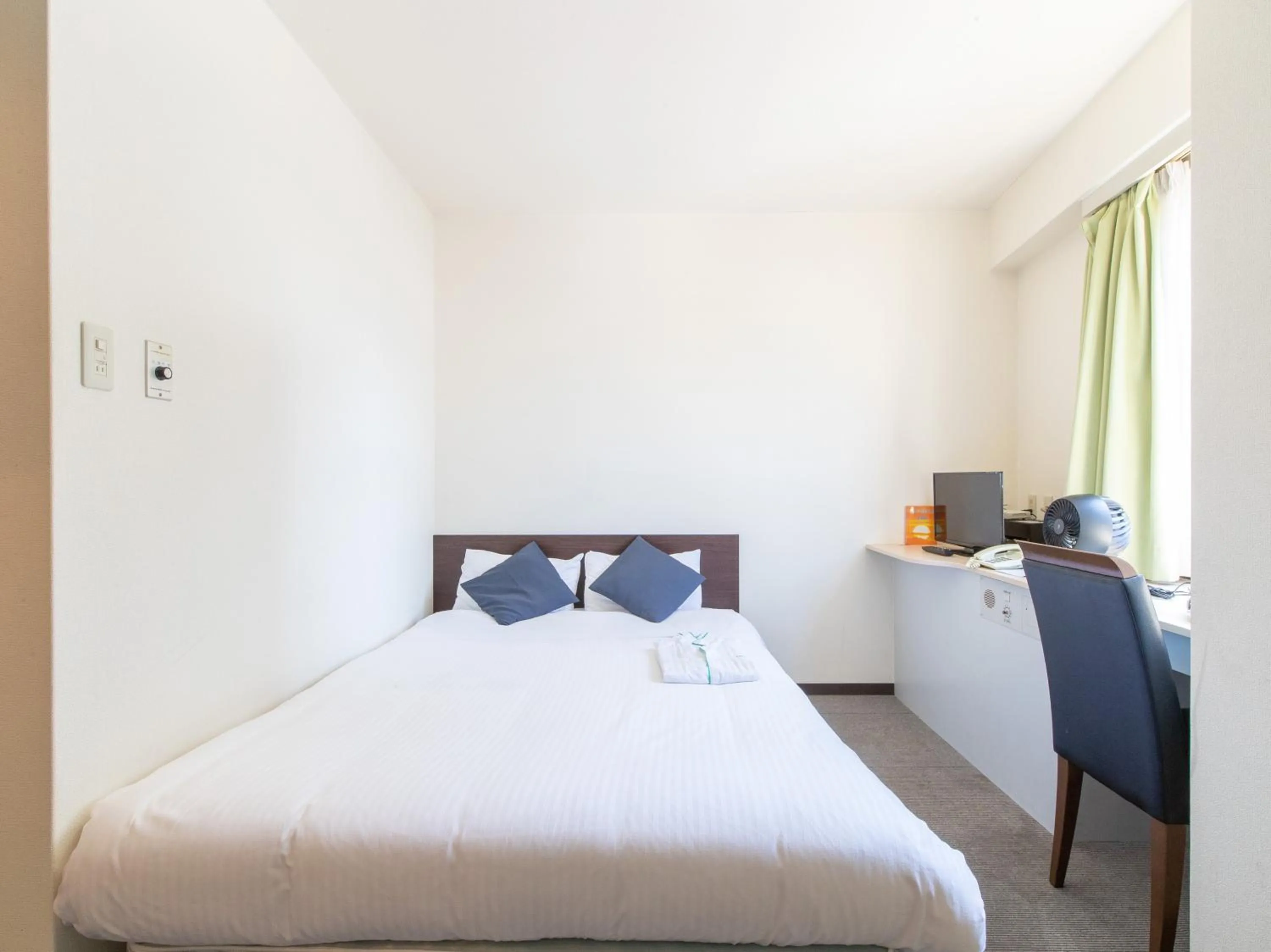 Bed in Tabist Sasebo Palace Hotel