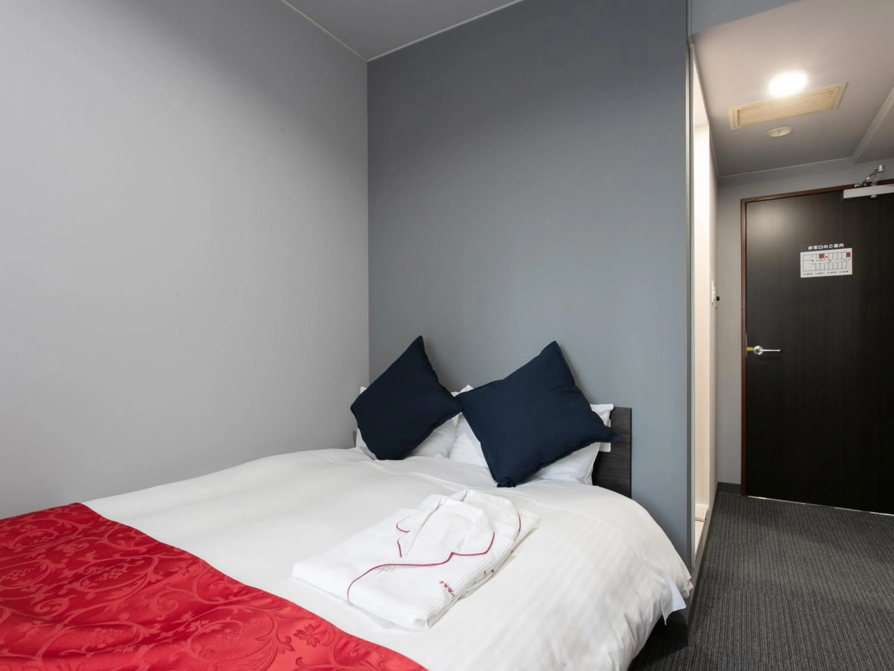 Bed in Tabist Sasebo Palace Hotel