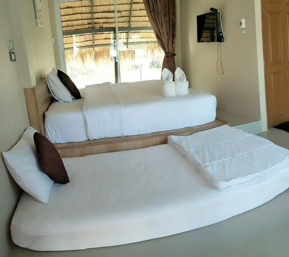 Bed in Suwi Coco Ville Resort
