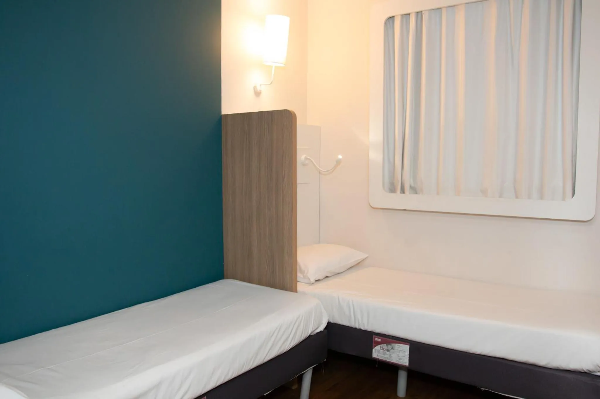 Bedroom in ibis budget Manhuaçu