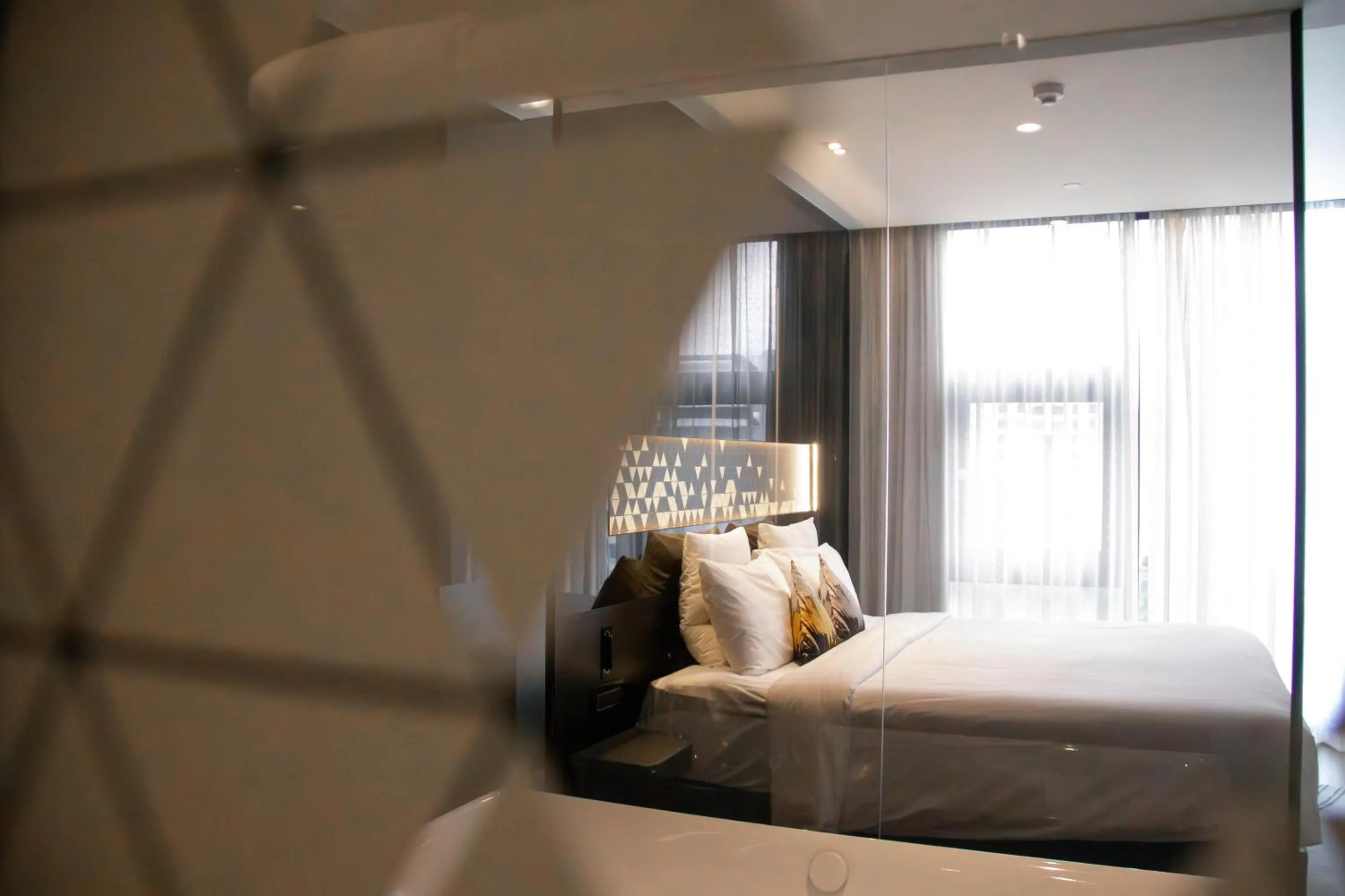 Bed in Novotel Singapore On Stevens