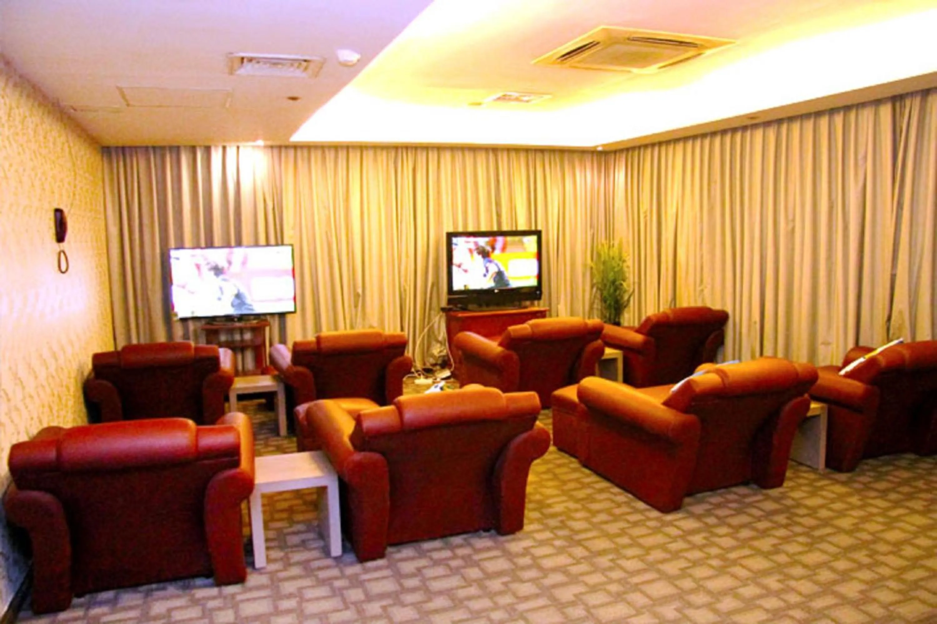 Communal lounge/ TV room in New Pacific Hotel