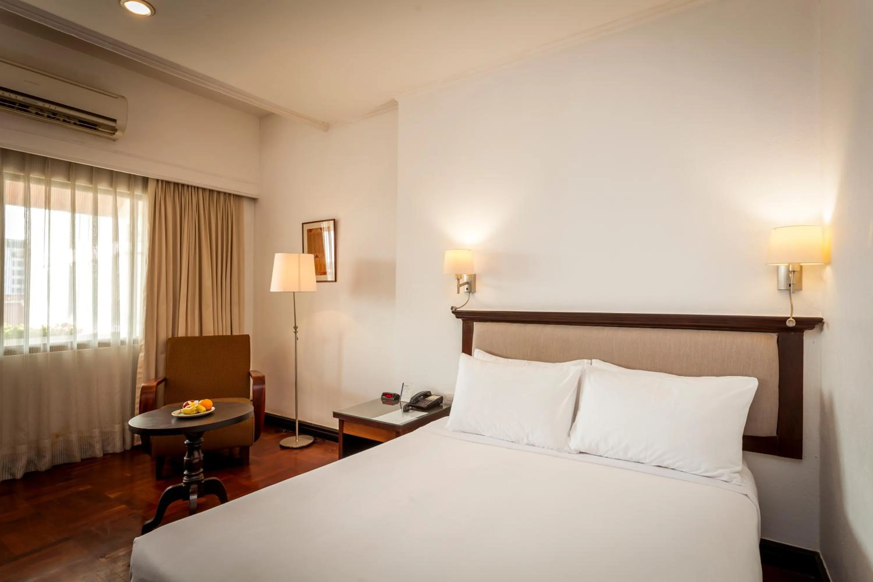 Bed in Le Charme Vientiane Hotel