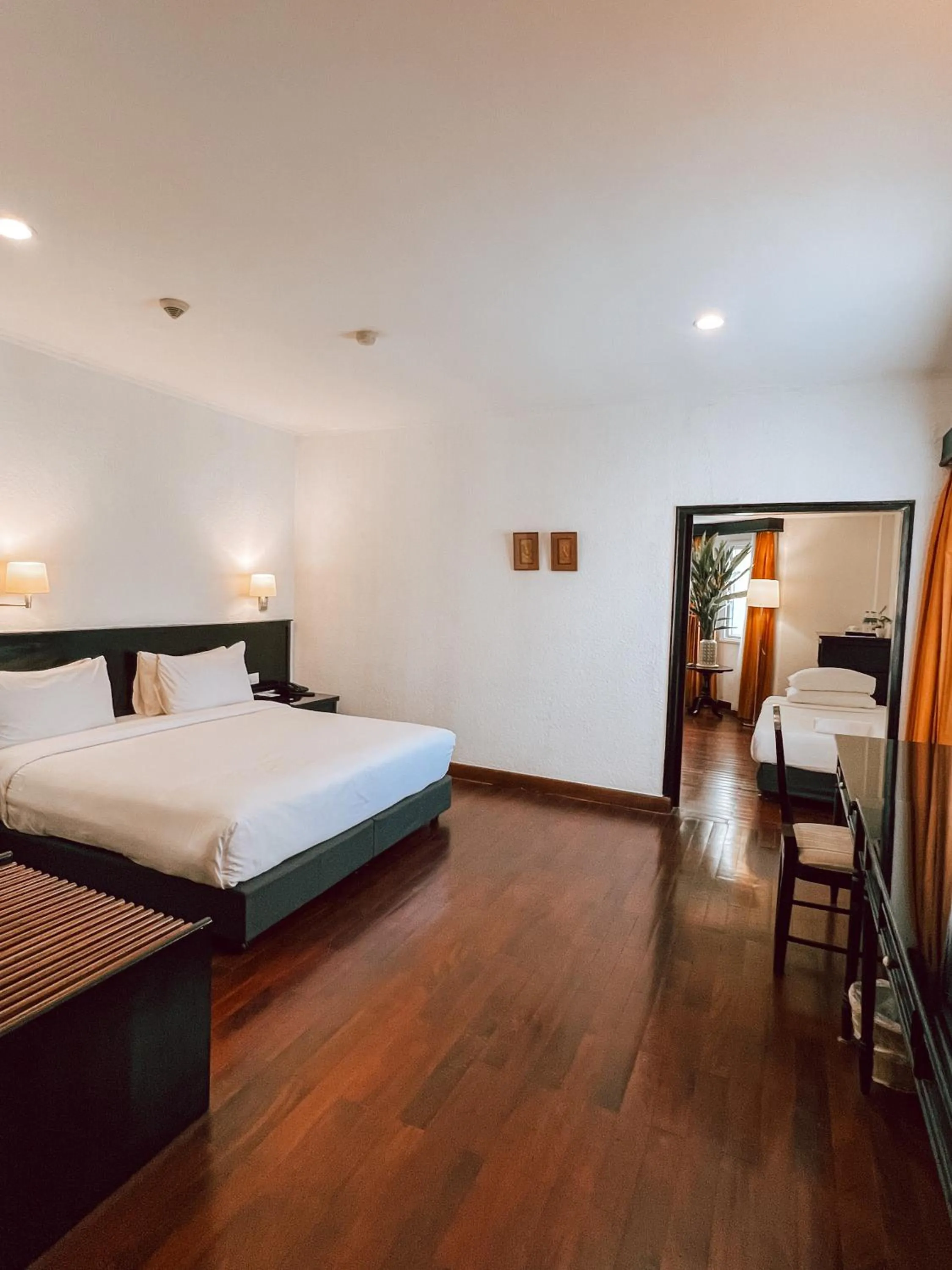 Bed in Le Charme Vientiane Hotel