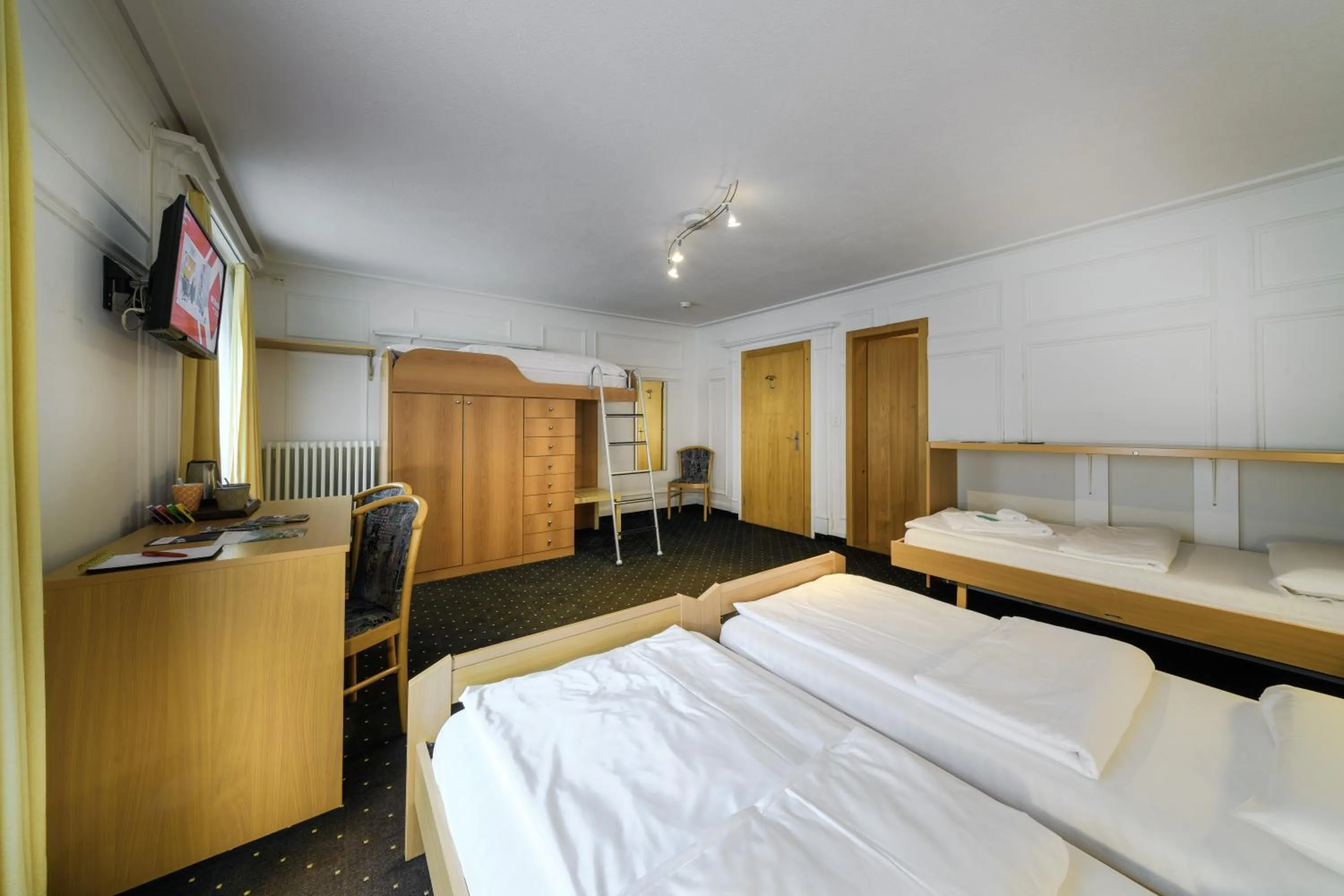 Bed in Poschiavo Suisse Hotel