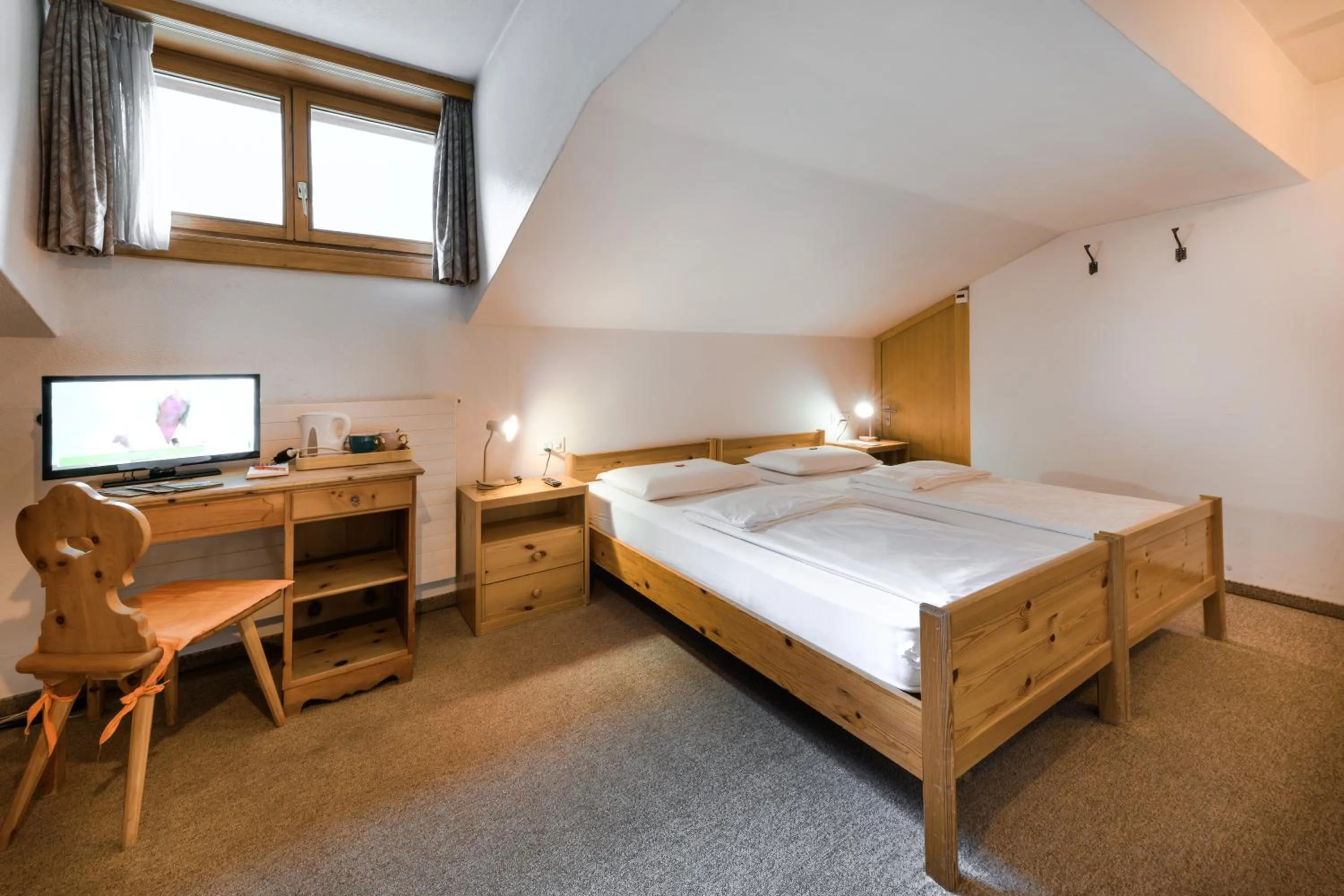 Bed in Poschiavo Suisse Hotel