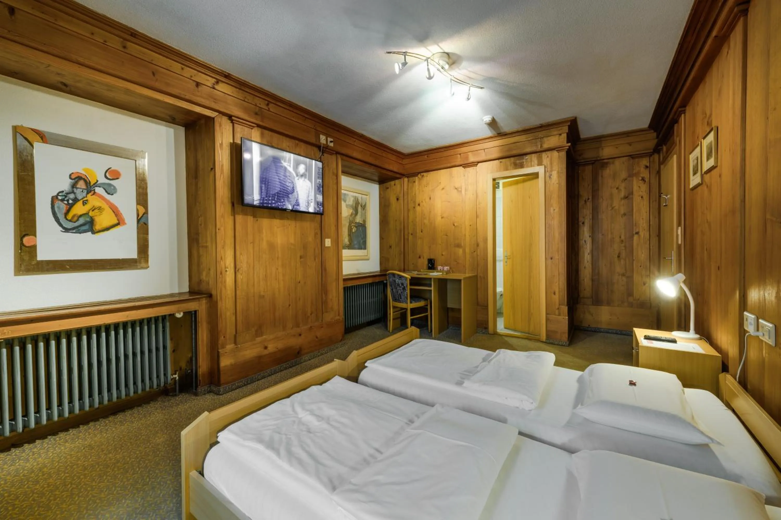 Bed in Poschiavo Suisse Hotel