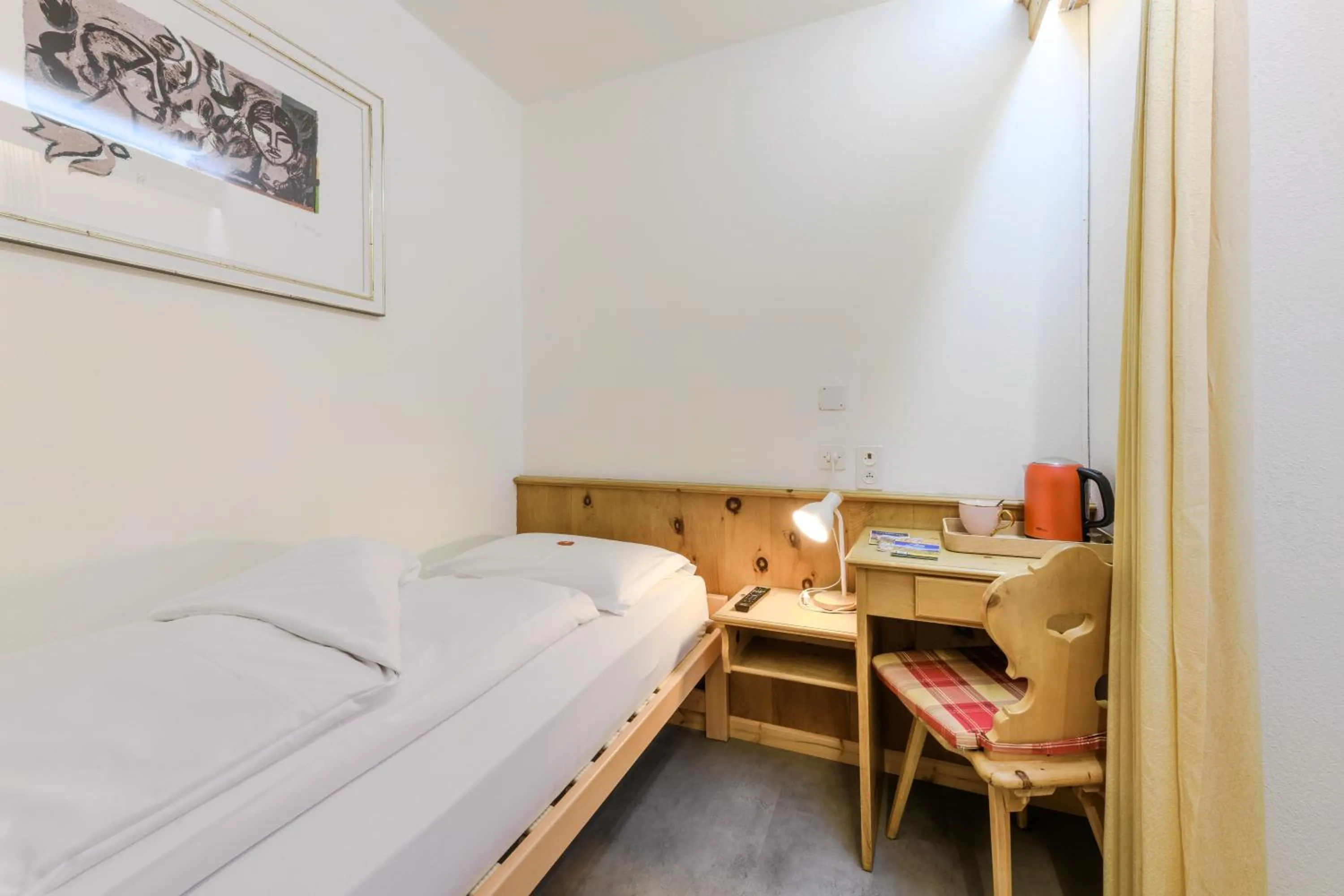 Bed in Poschiavo Suisse Hotel