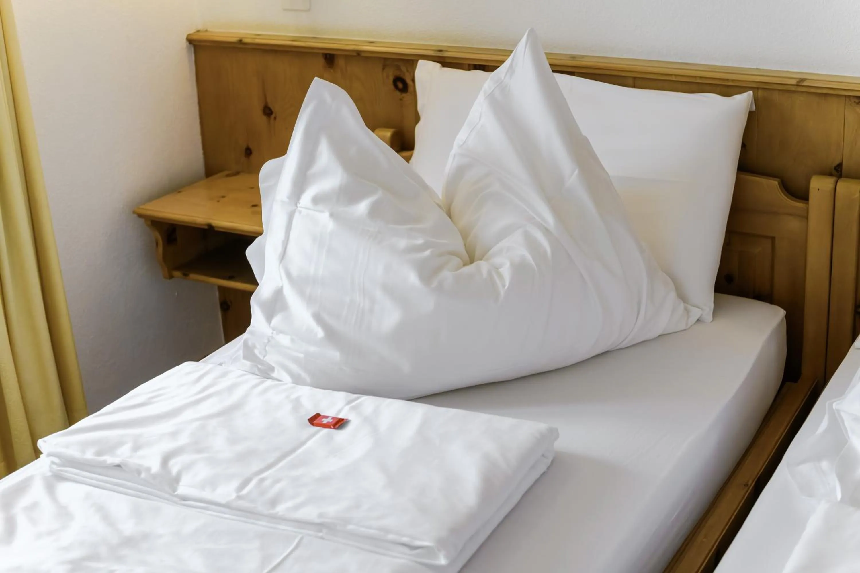 Bed in Poschiavo Suisse Hotel