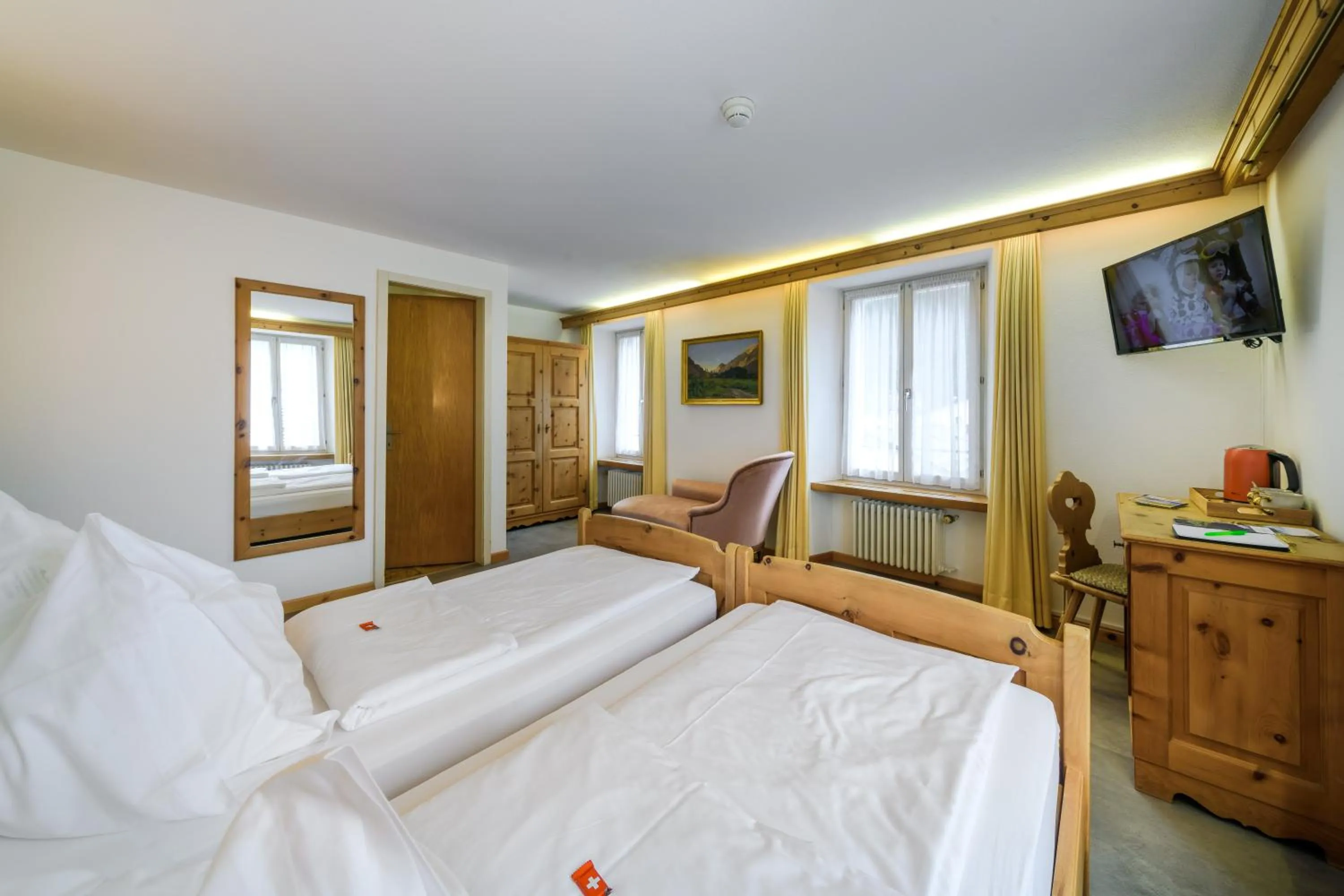 Bed in Poschiavo Suisse Hotel