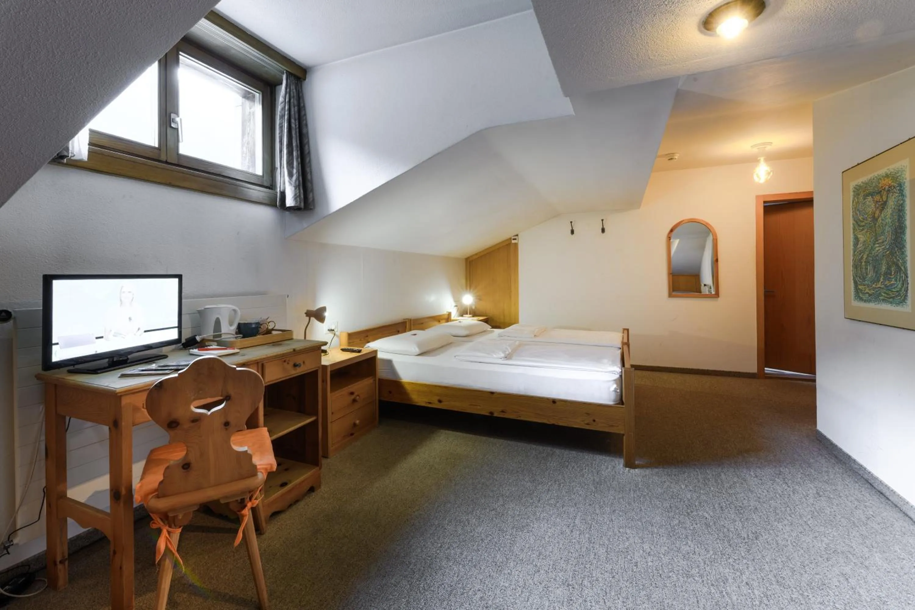 Bed in Poschiavo Suisse Hotel