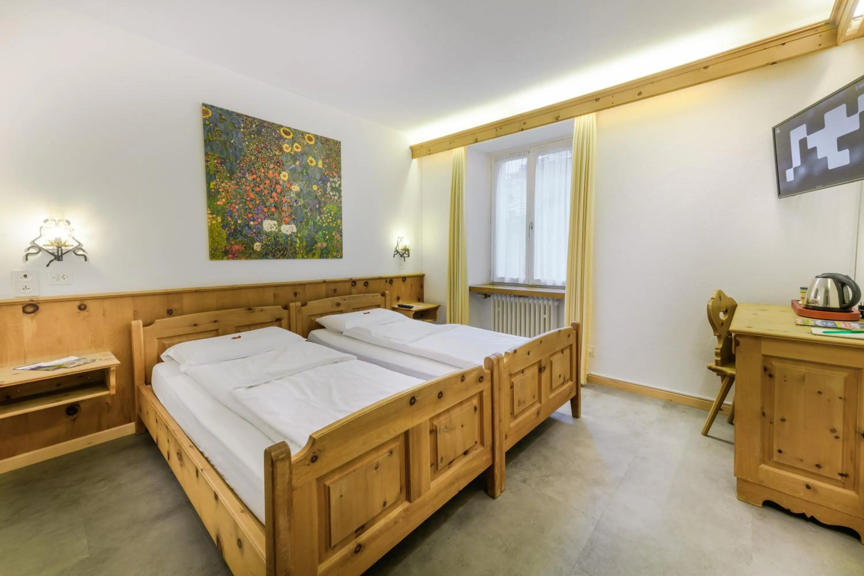 Bed in Poschiavo Suisse Hotel