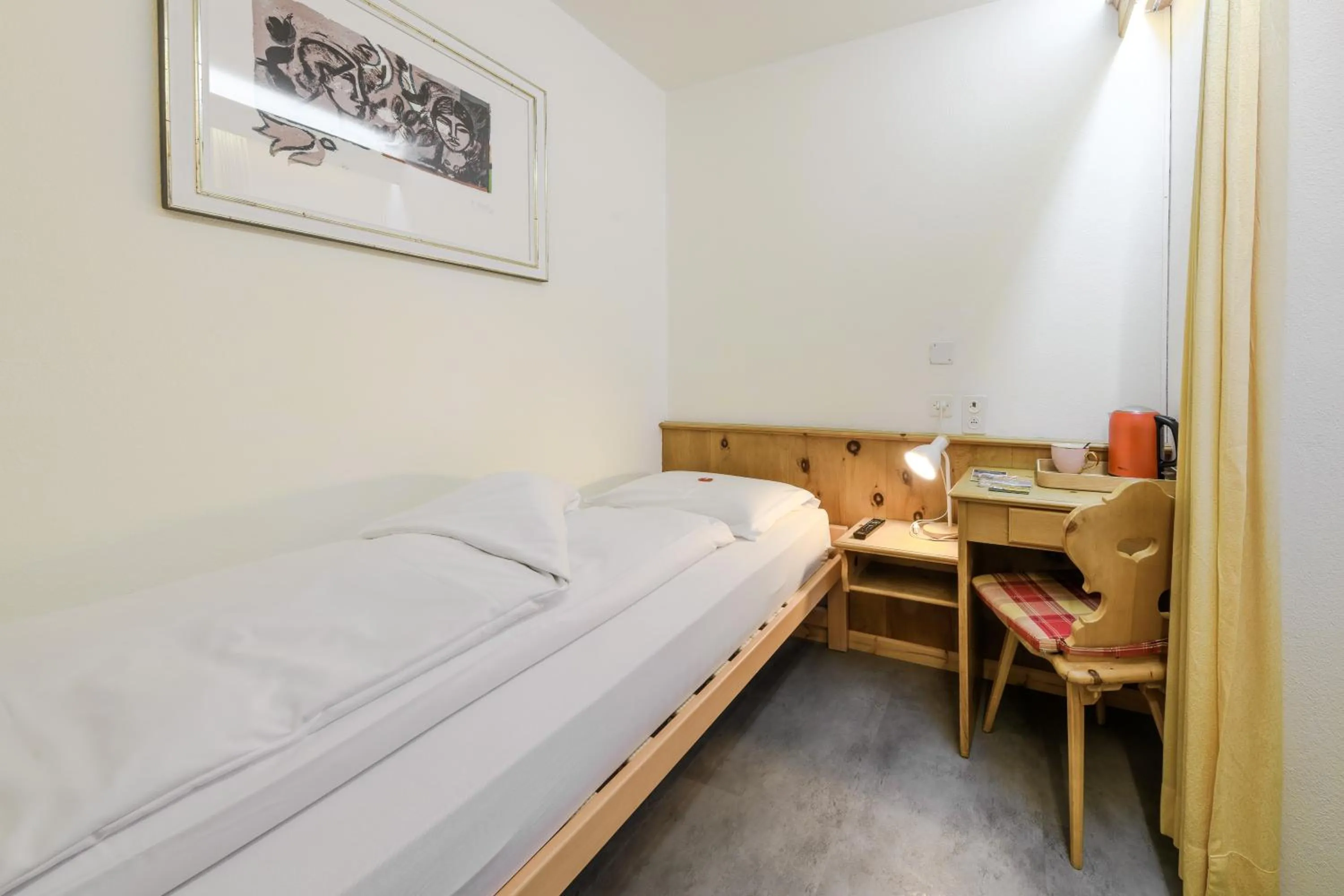 Bed in Poschiavo Suisse Hotel