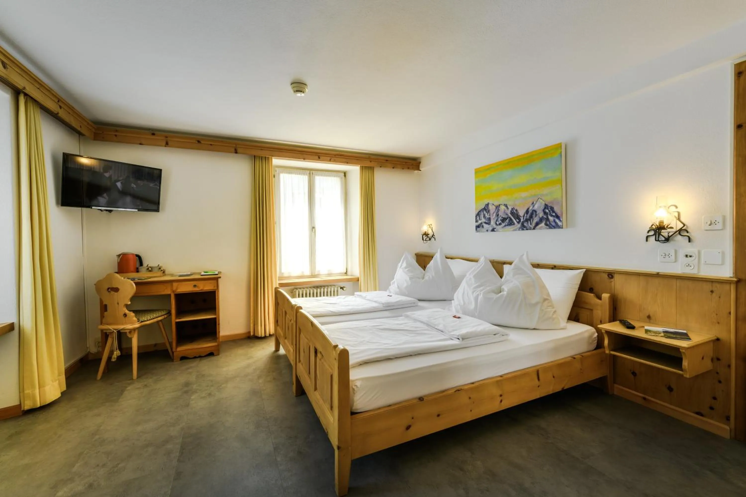 Bed in Poschiavo Suisse Hotel