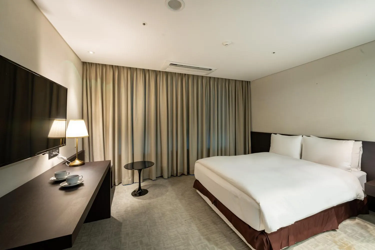 Bed in Ramada Encore by Wyndham CheonAn