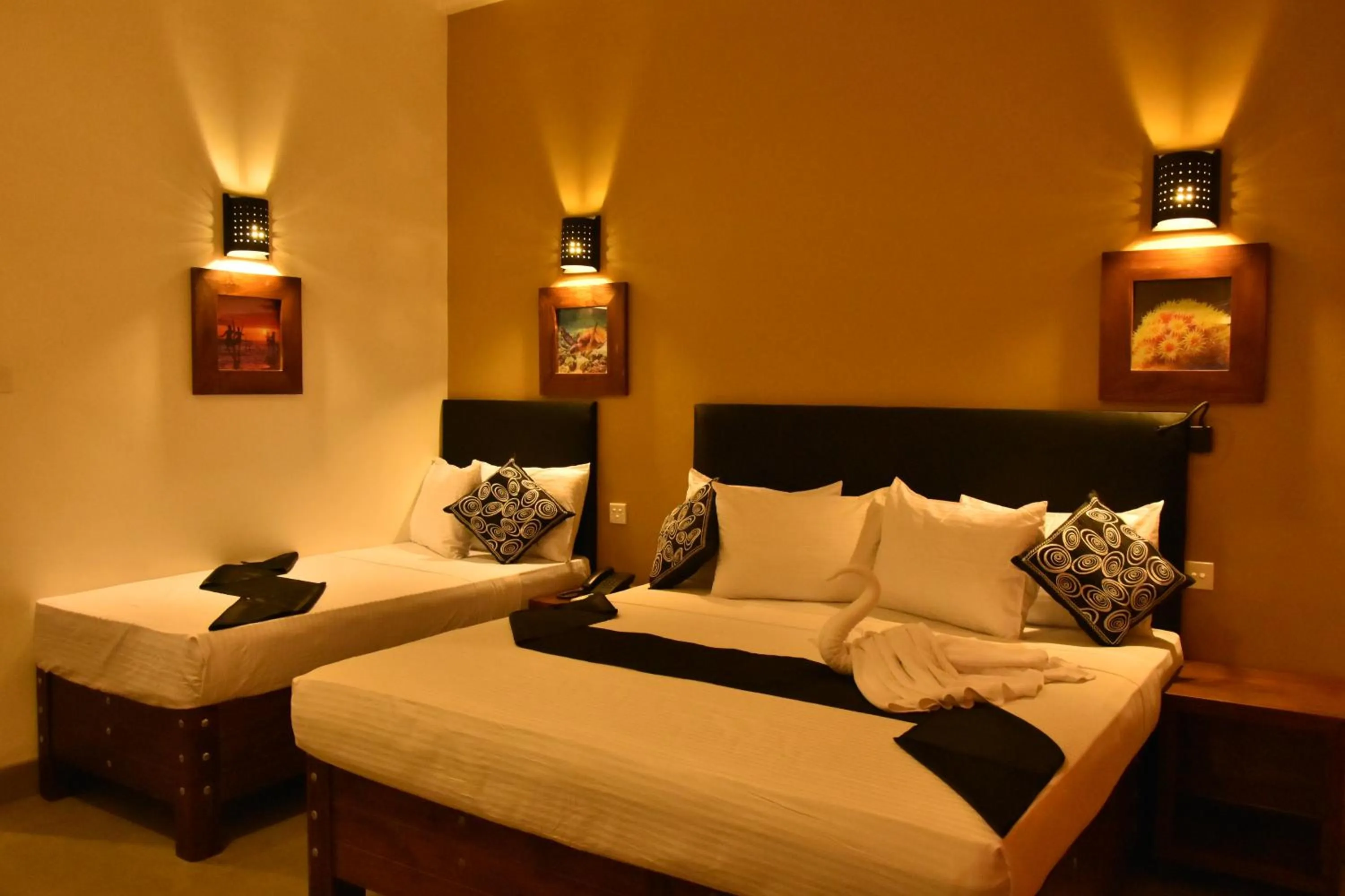 Bed in Nil Diya Beach Resort