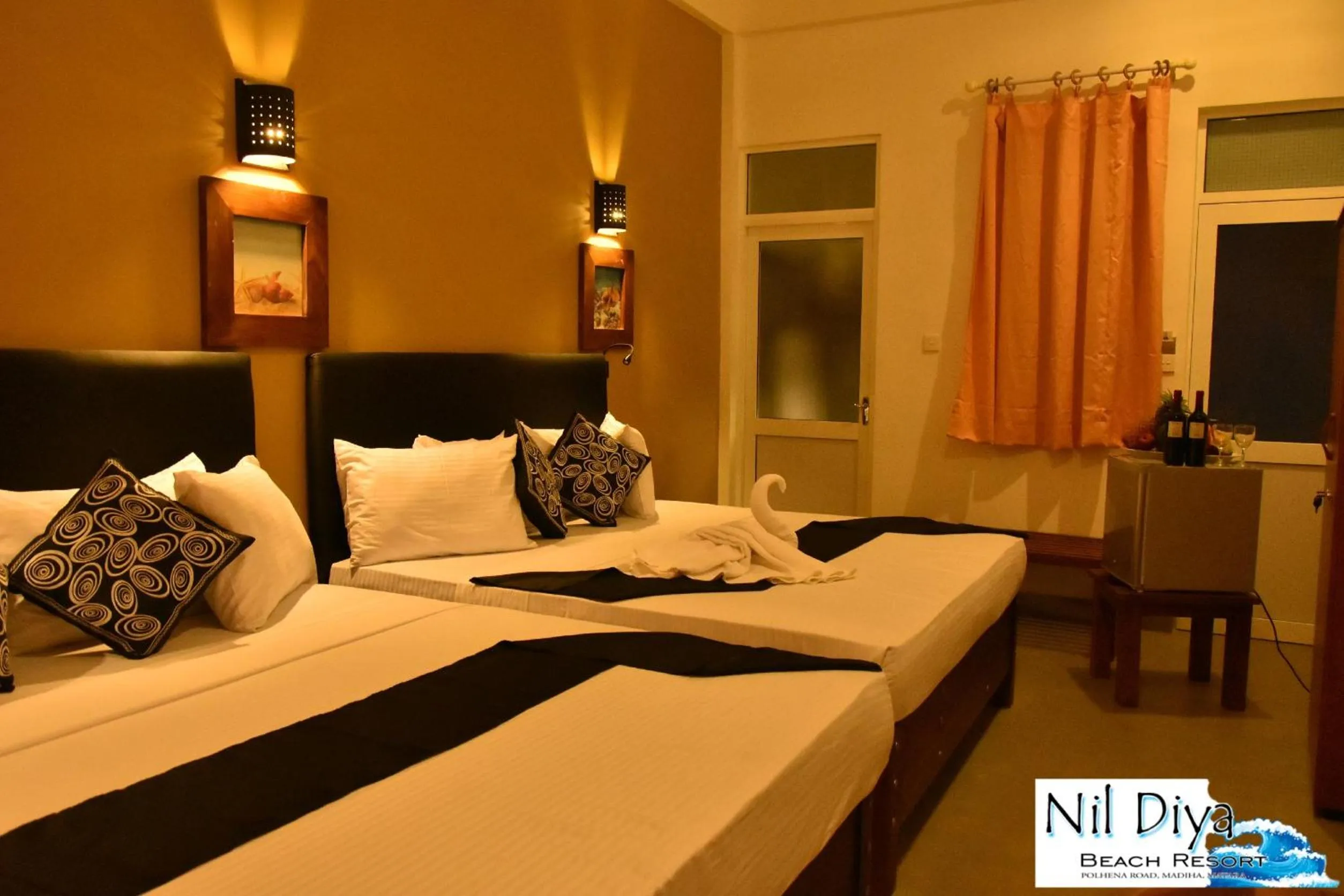 Bed in Nil Diya Beach Resort