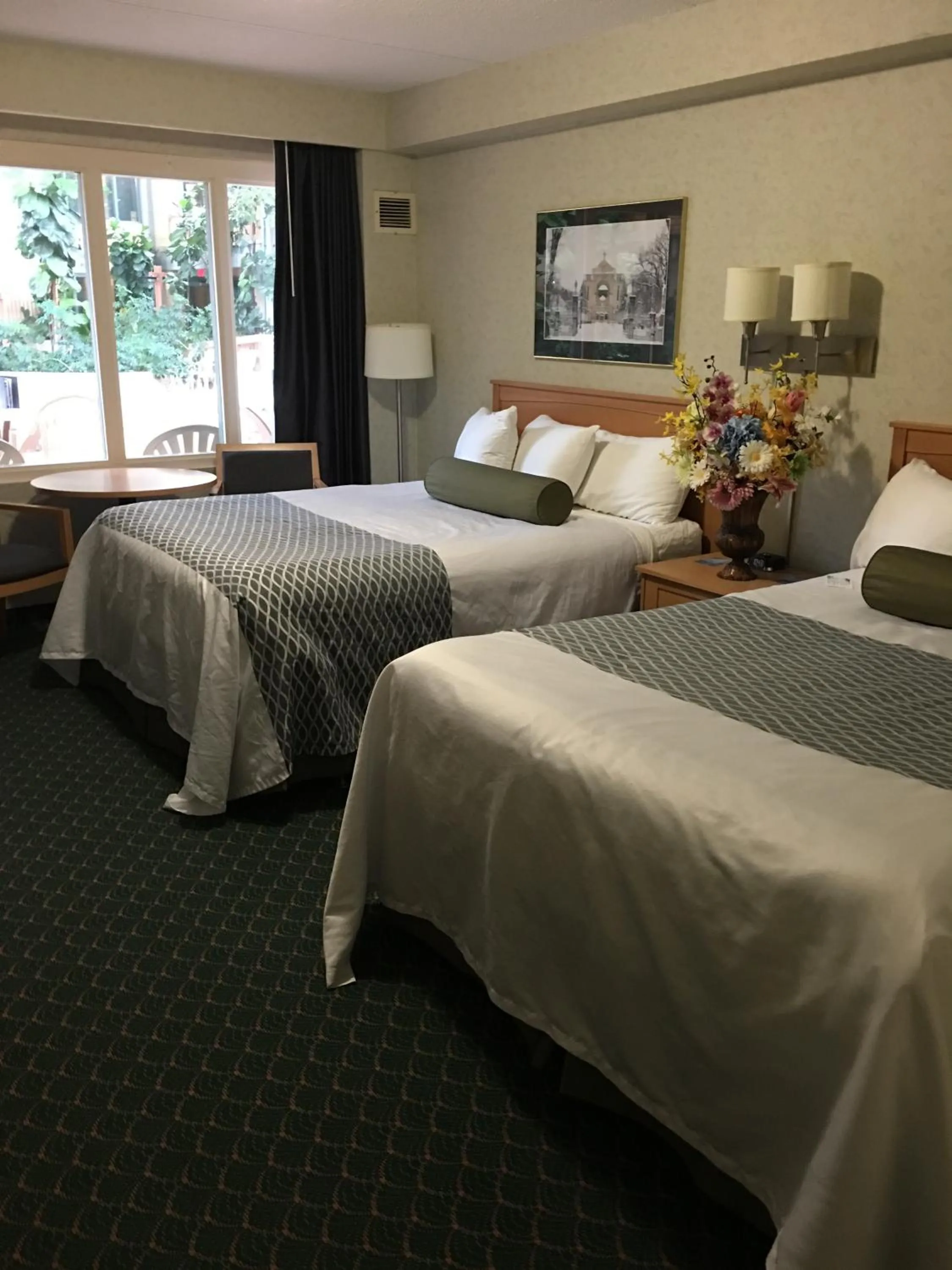 Swimming pool, Bed in Travelodge by Wyndham Winnipeg East