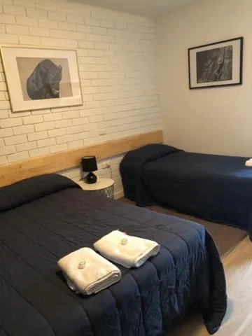 Bed in Colony Inn Hotel