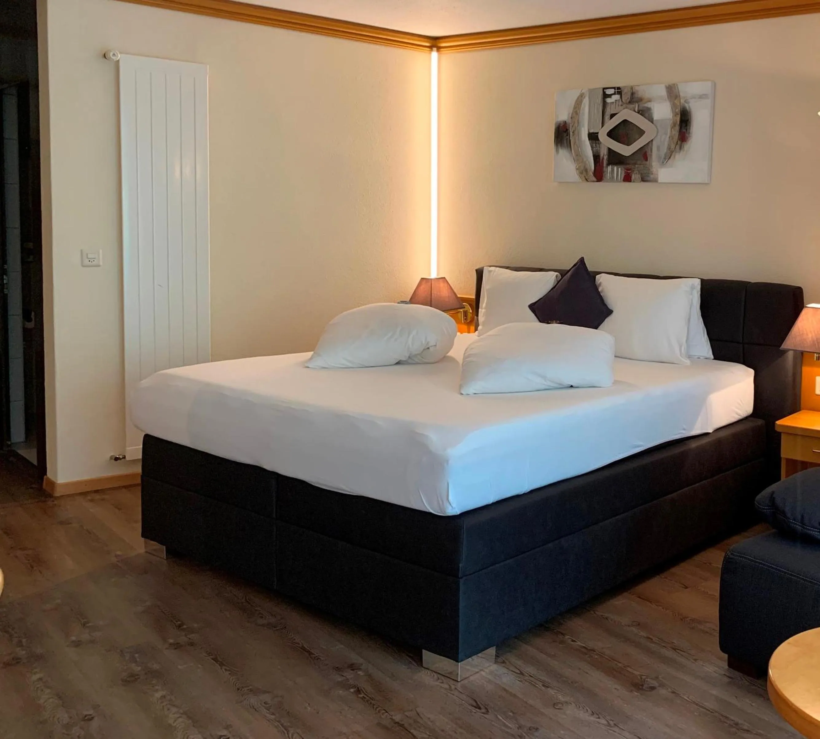 Photo of the whole room, Bed in Hotel Quellenhof Leukerbad