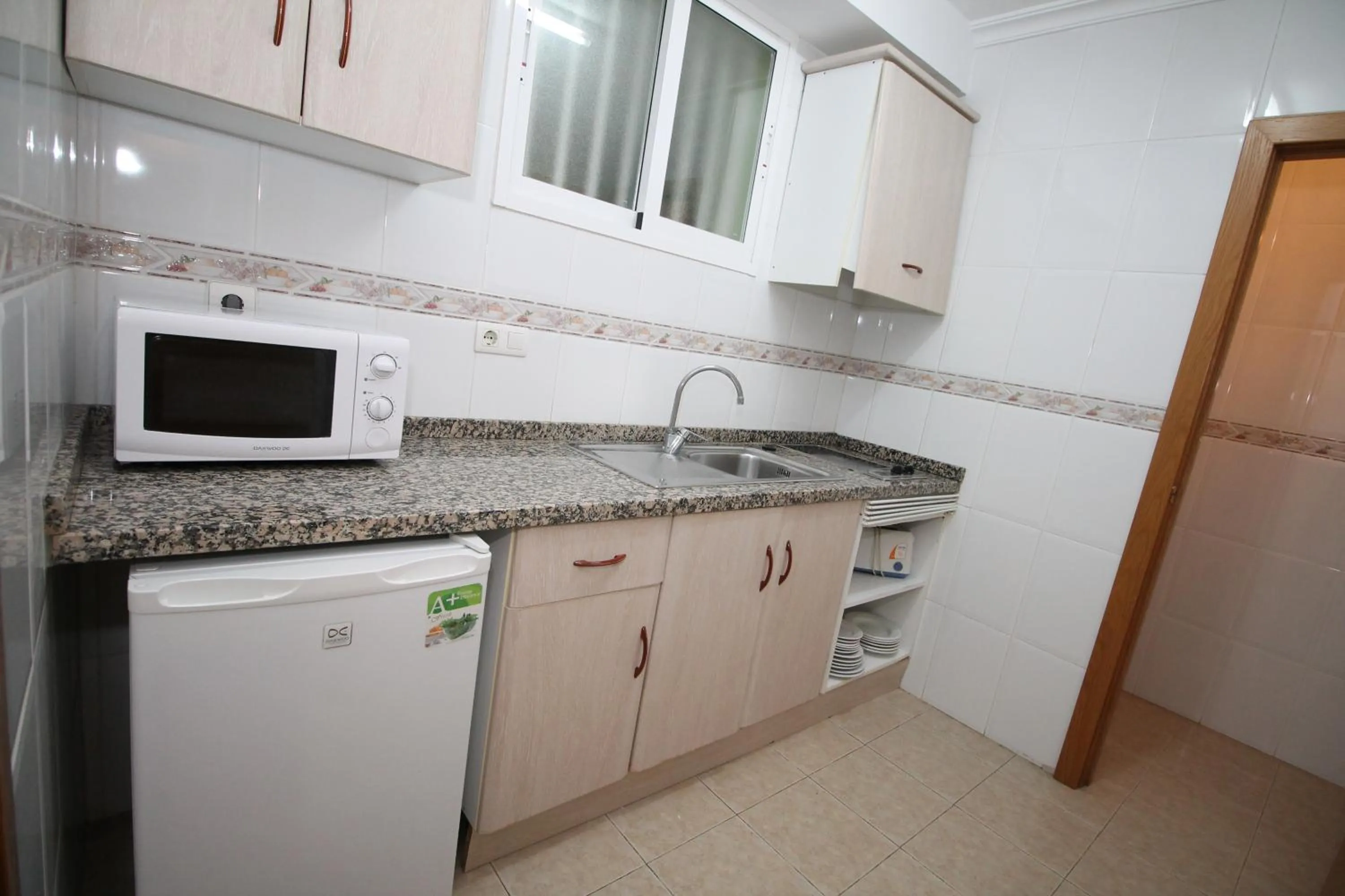 Kitchen or kitchenette in Apartamentos Playamar