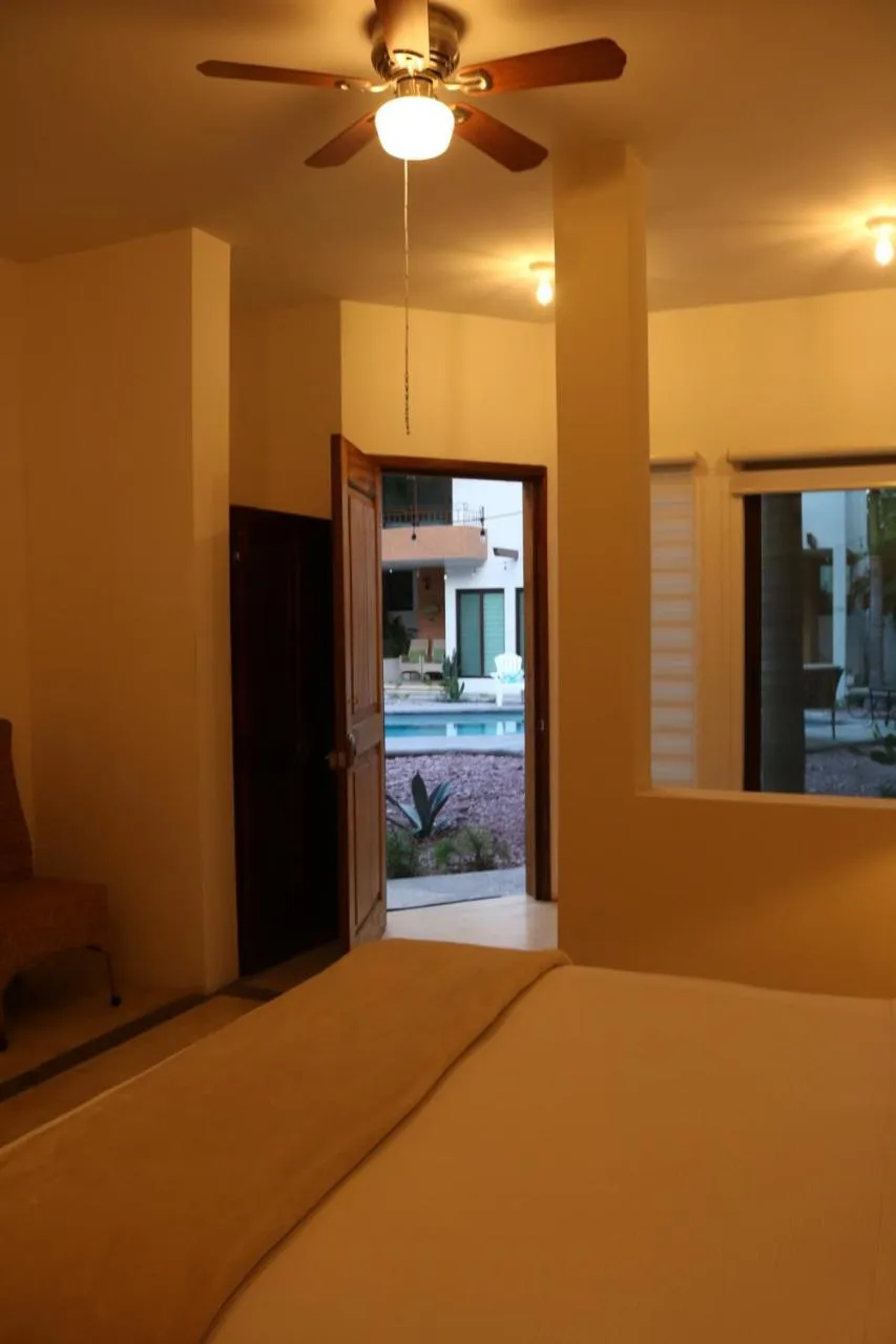 Photo of the whole room, Bed in Casa Bugambilias