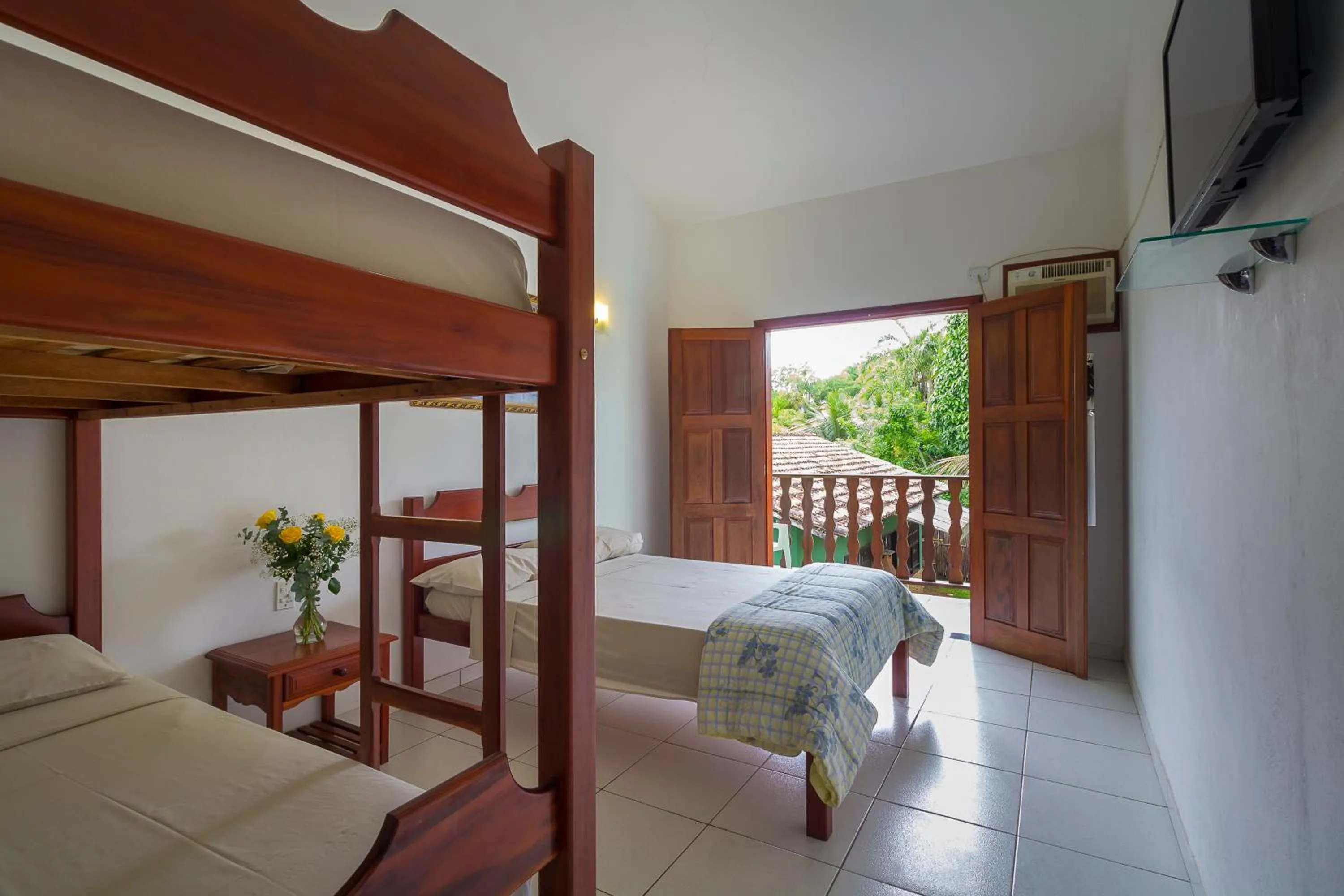 Bed in Pousada Camila
