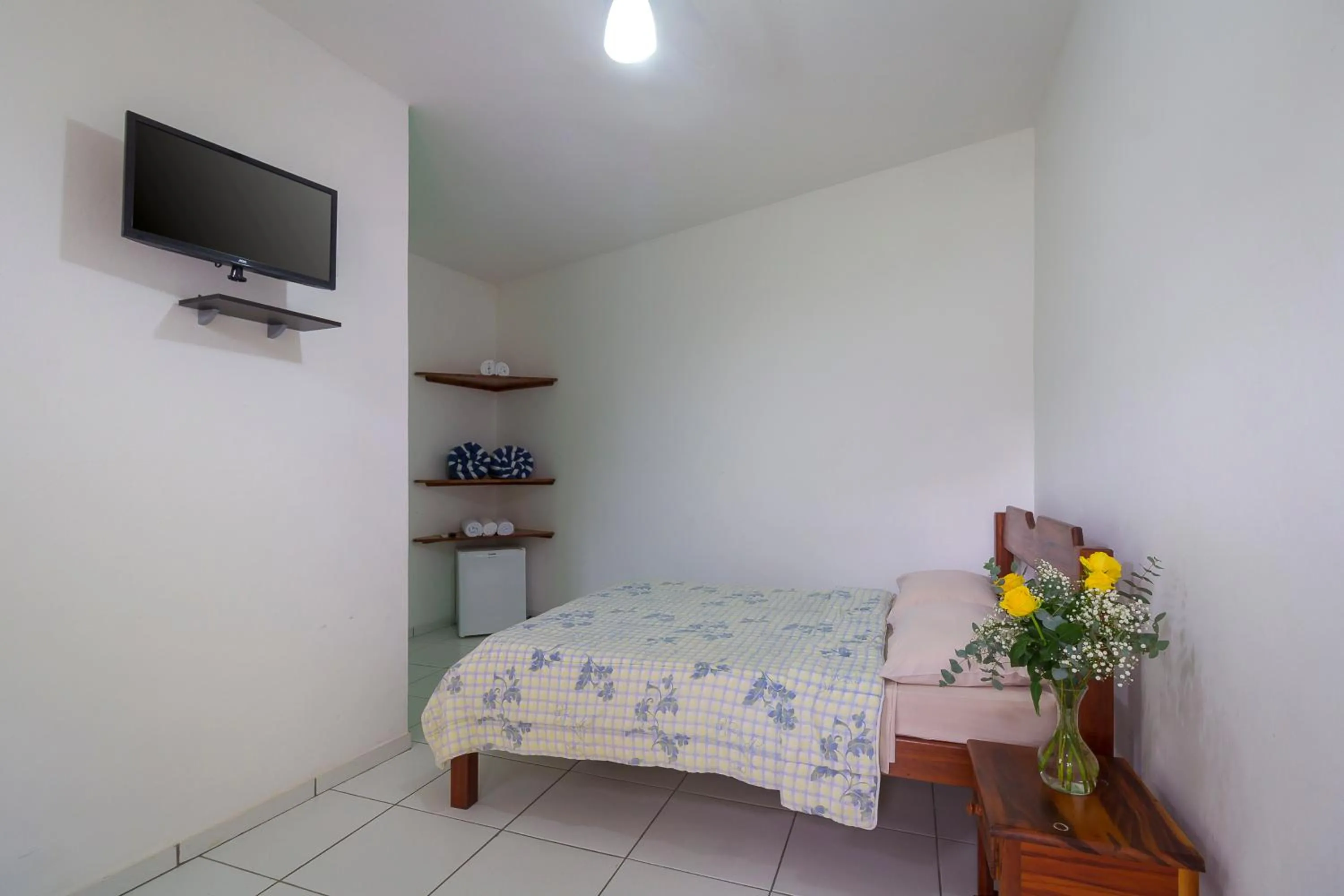 Bed in Pousada Camila