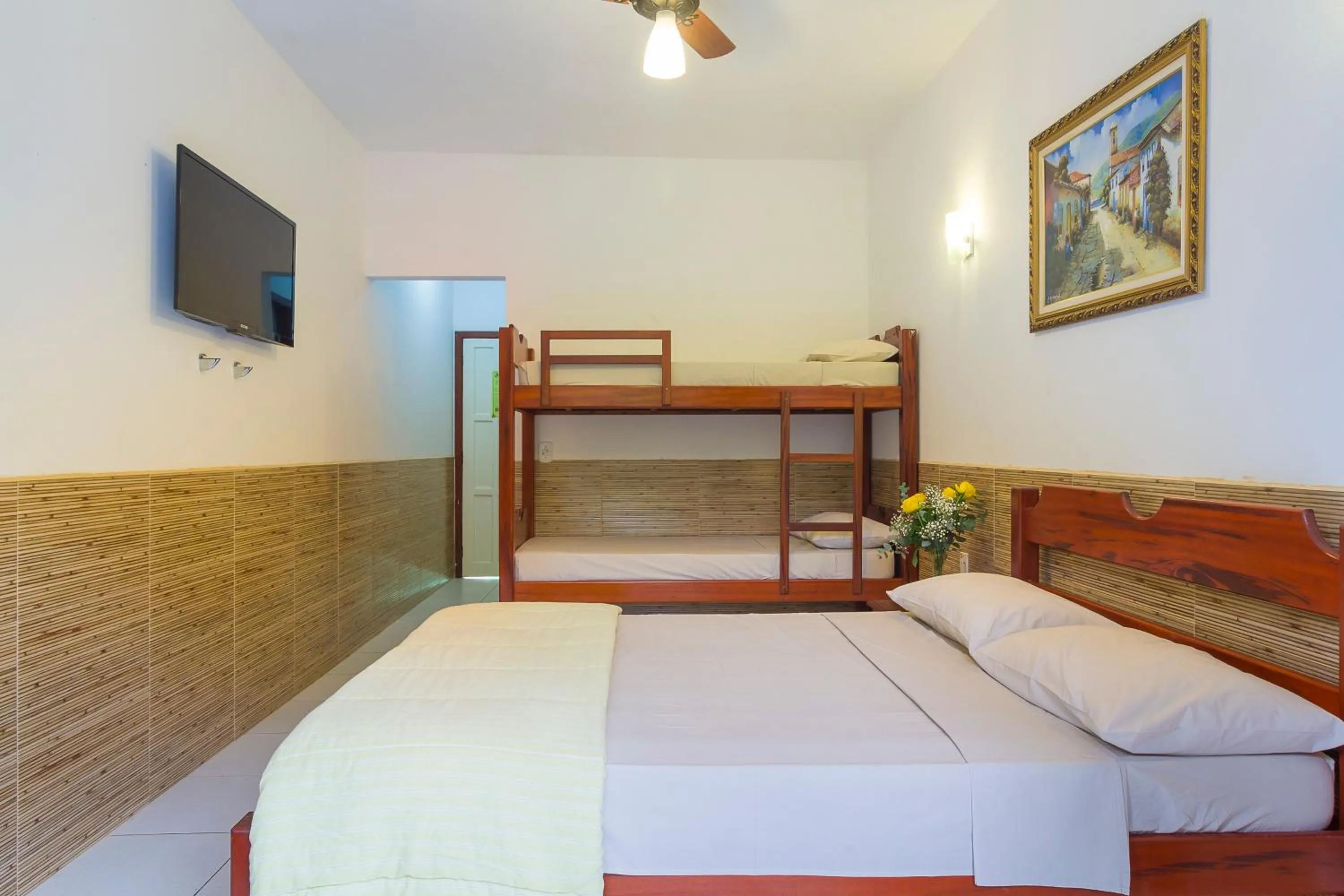 Bed in Pousada Camila