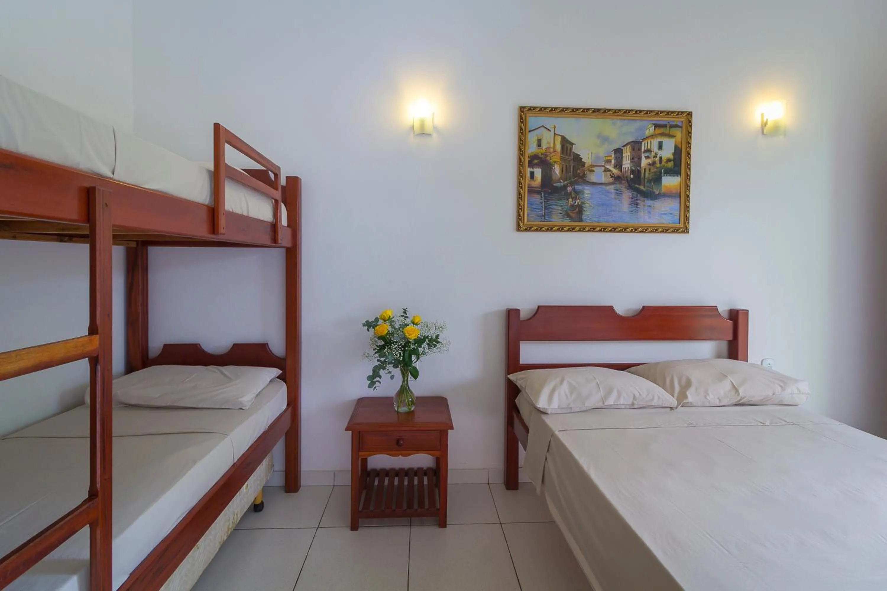 Bed in Pousada Camila