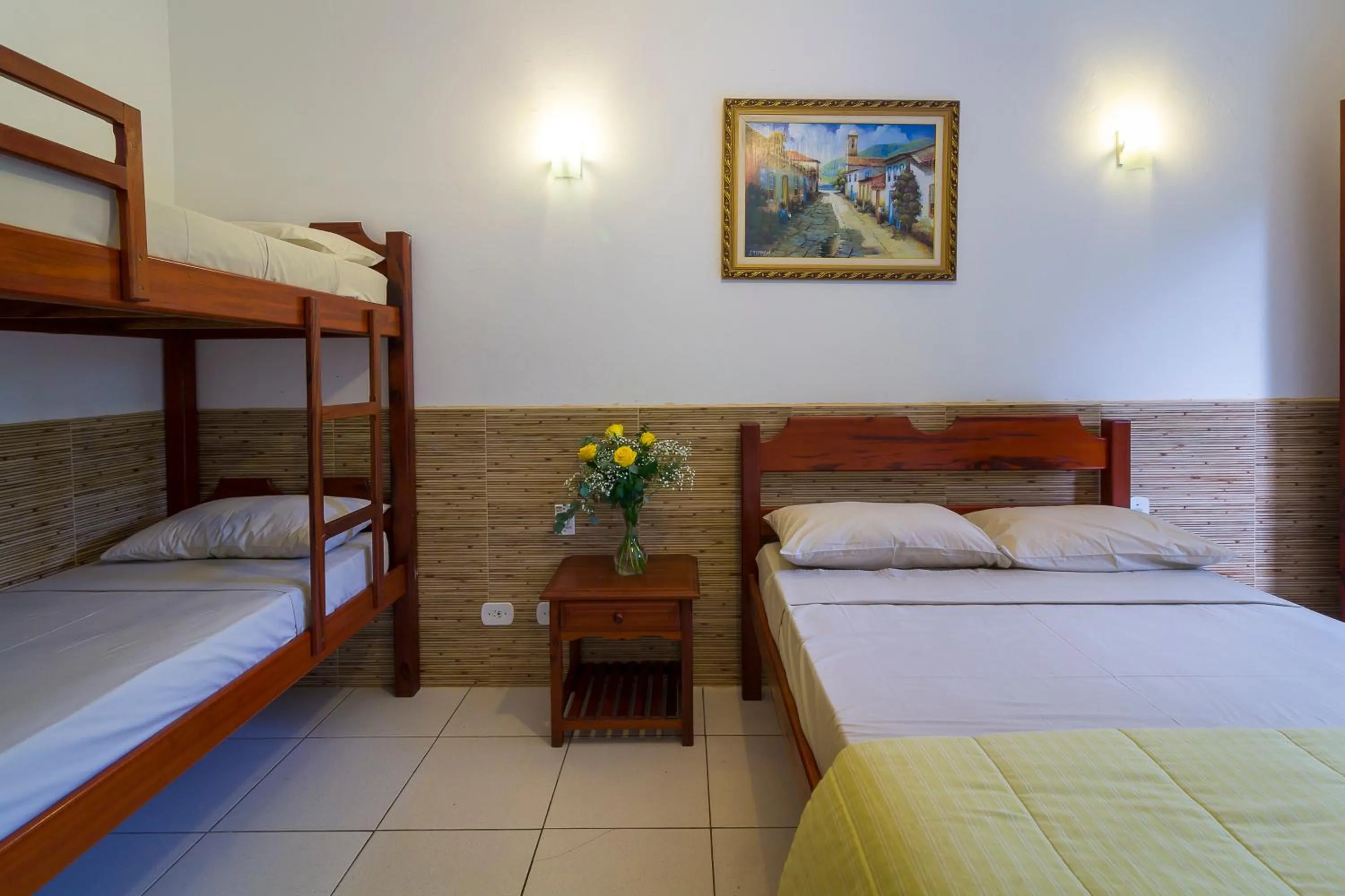 Bed in Pousada Camila