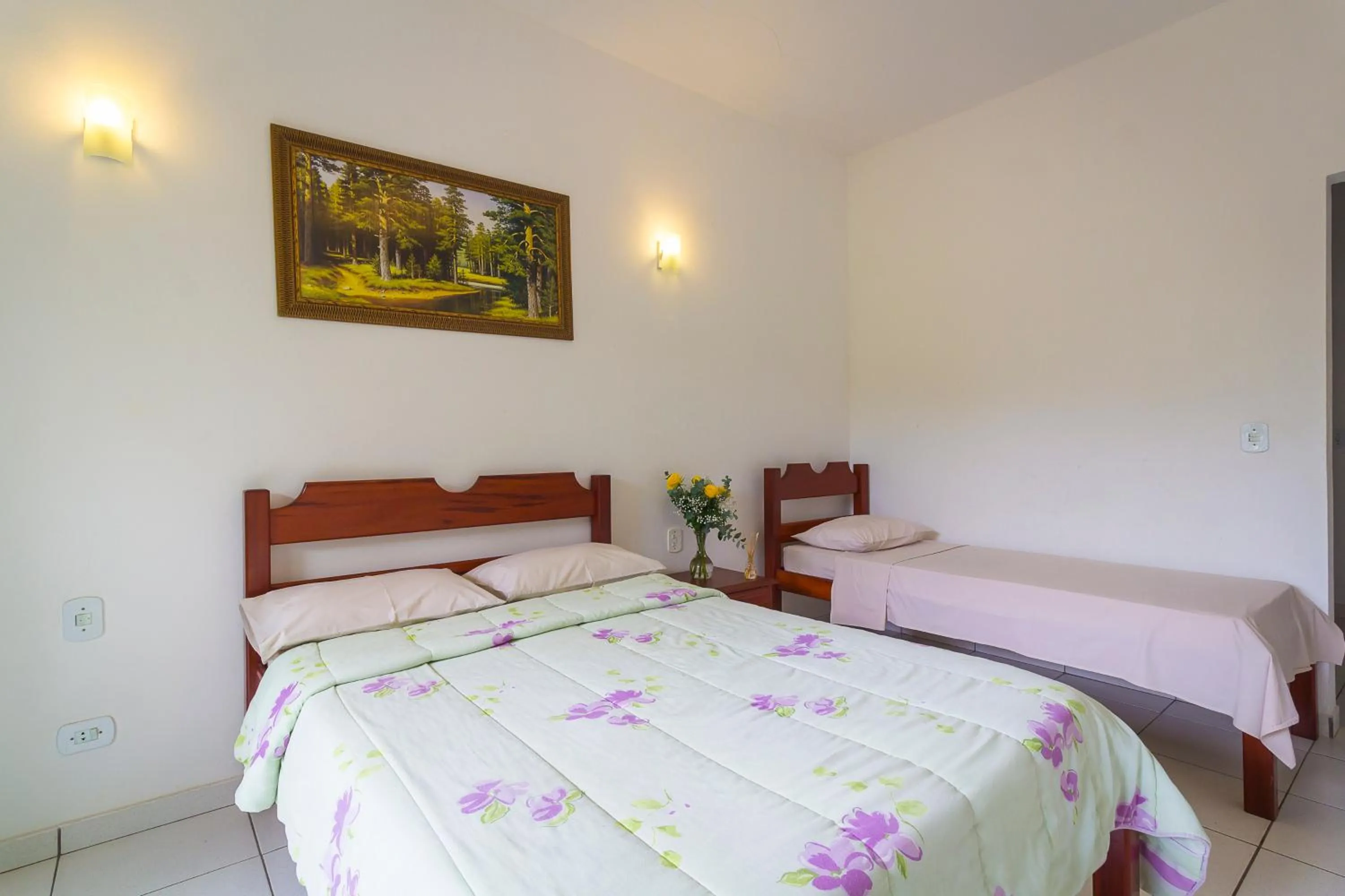 Bed in Pousada Camila