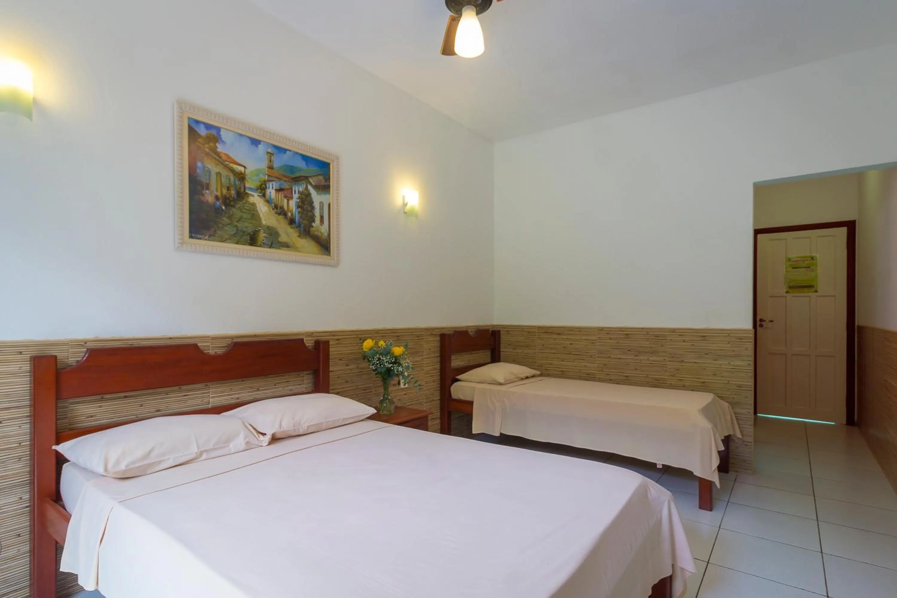 Bed in Pousada Camila