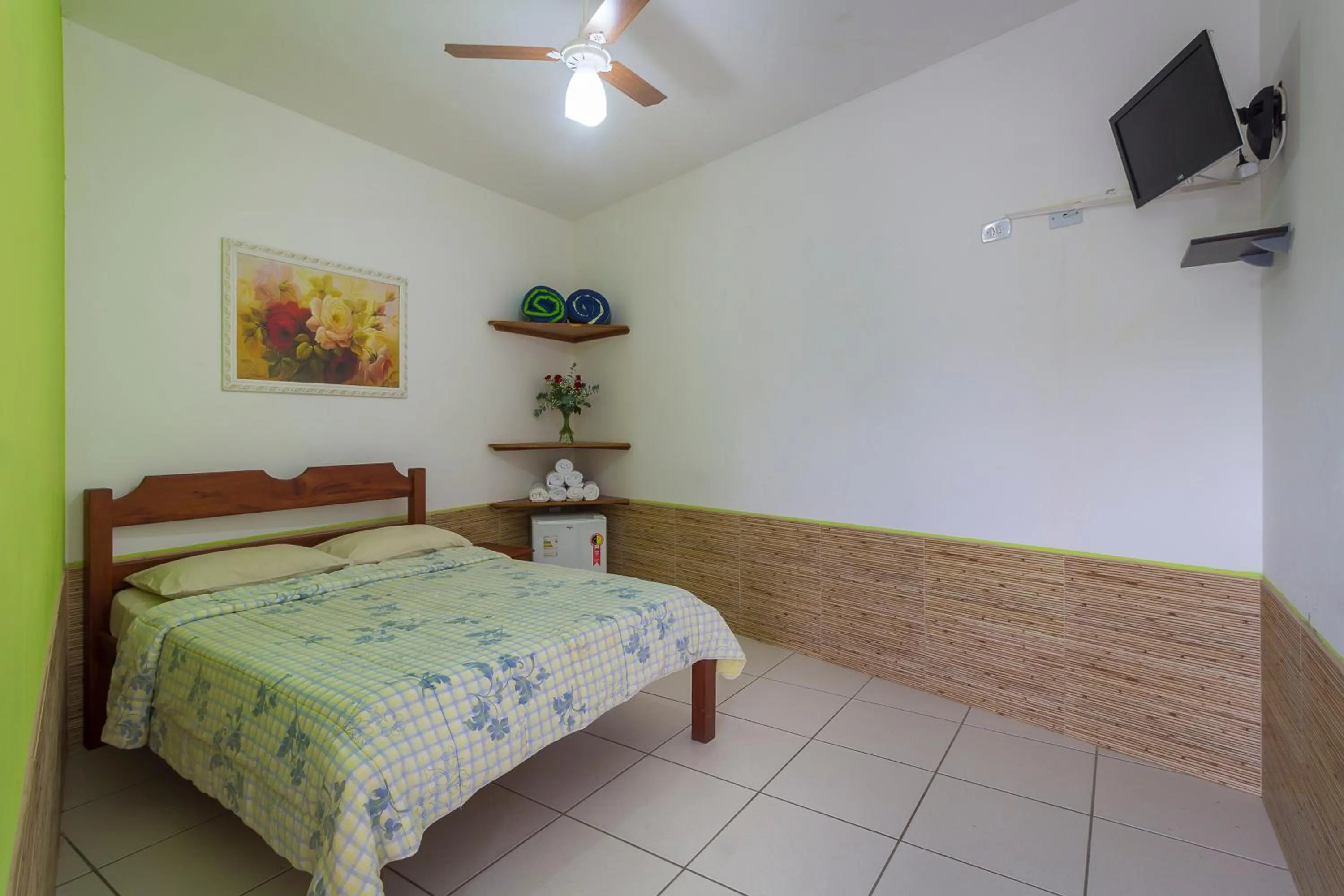 Bed in Pousada Camila