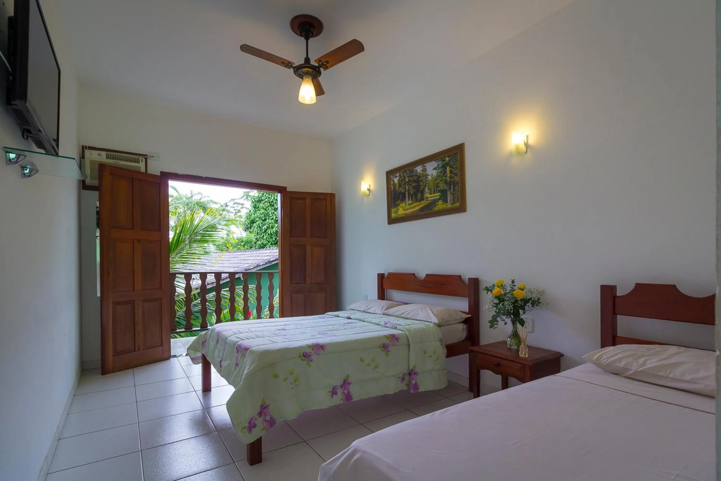 Bed in Pousada Camila
