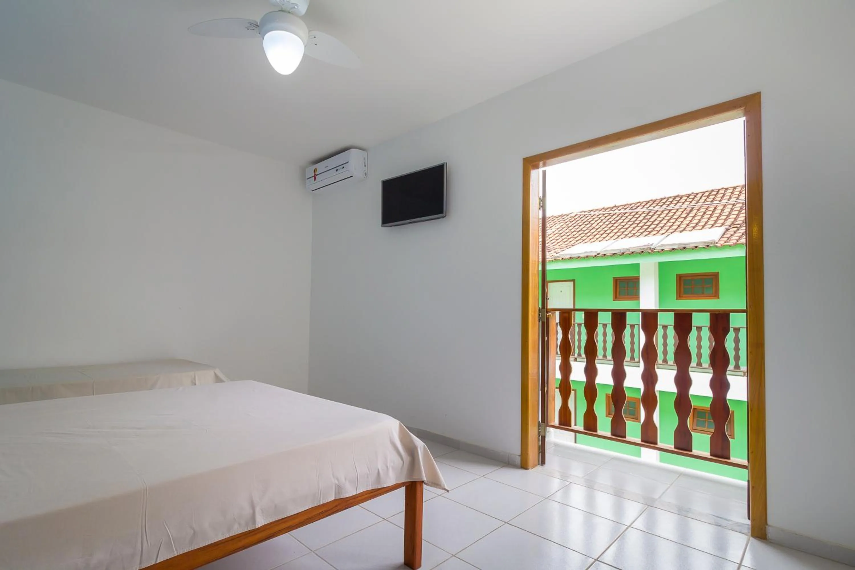 Bed in Pousada Camila