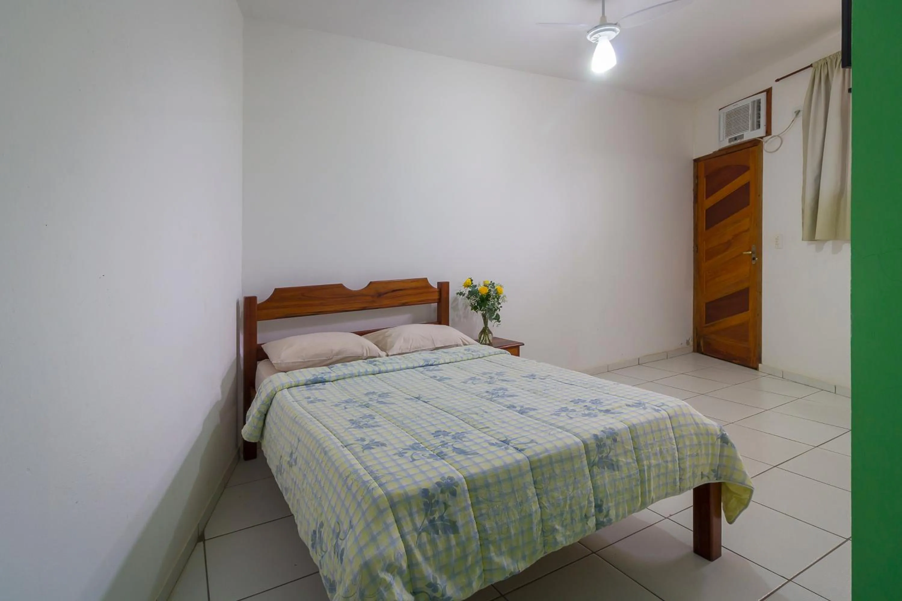 Bed in Pousada Camila