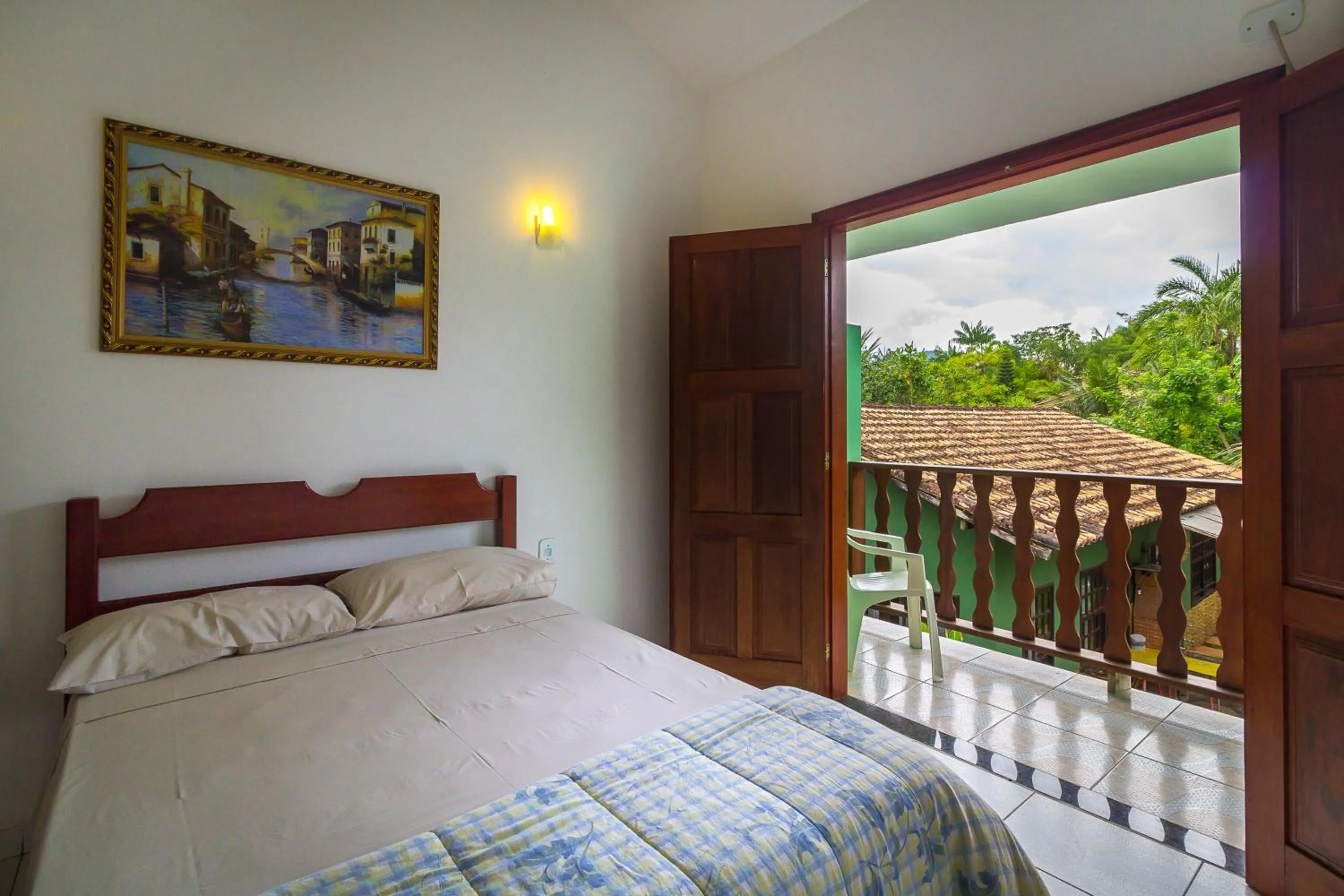 Bed in Pousada Camila