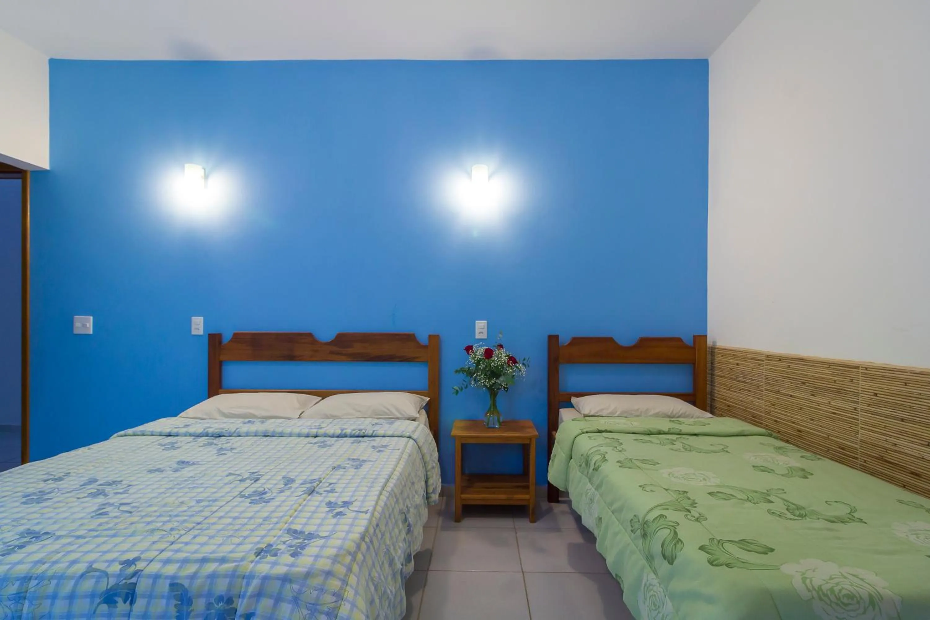 Bed in Pousada Camila