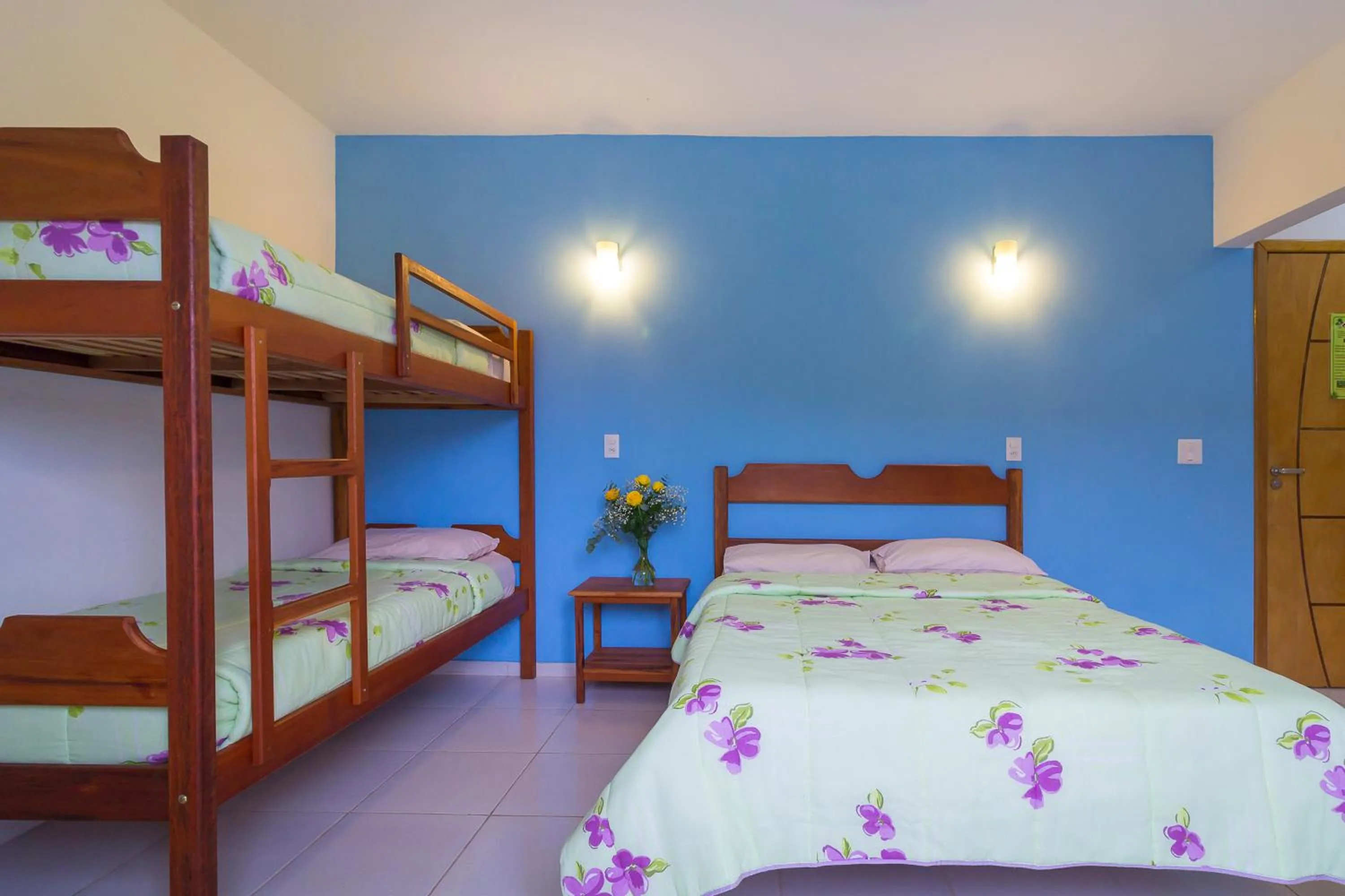 Bed in Pousada Camila