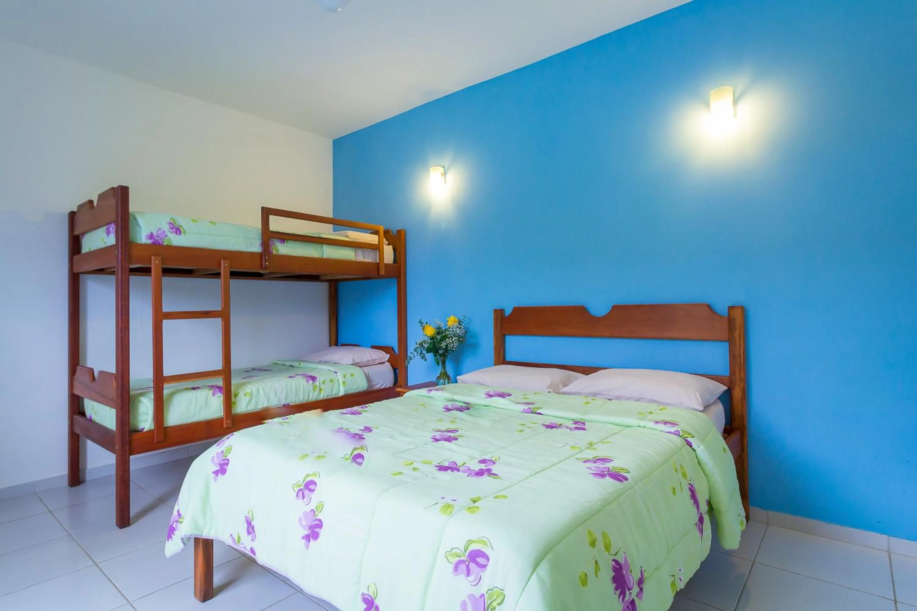 Bed in Pousada Camila