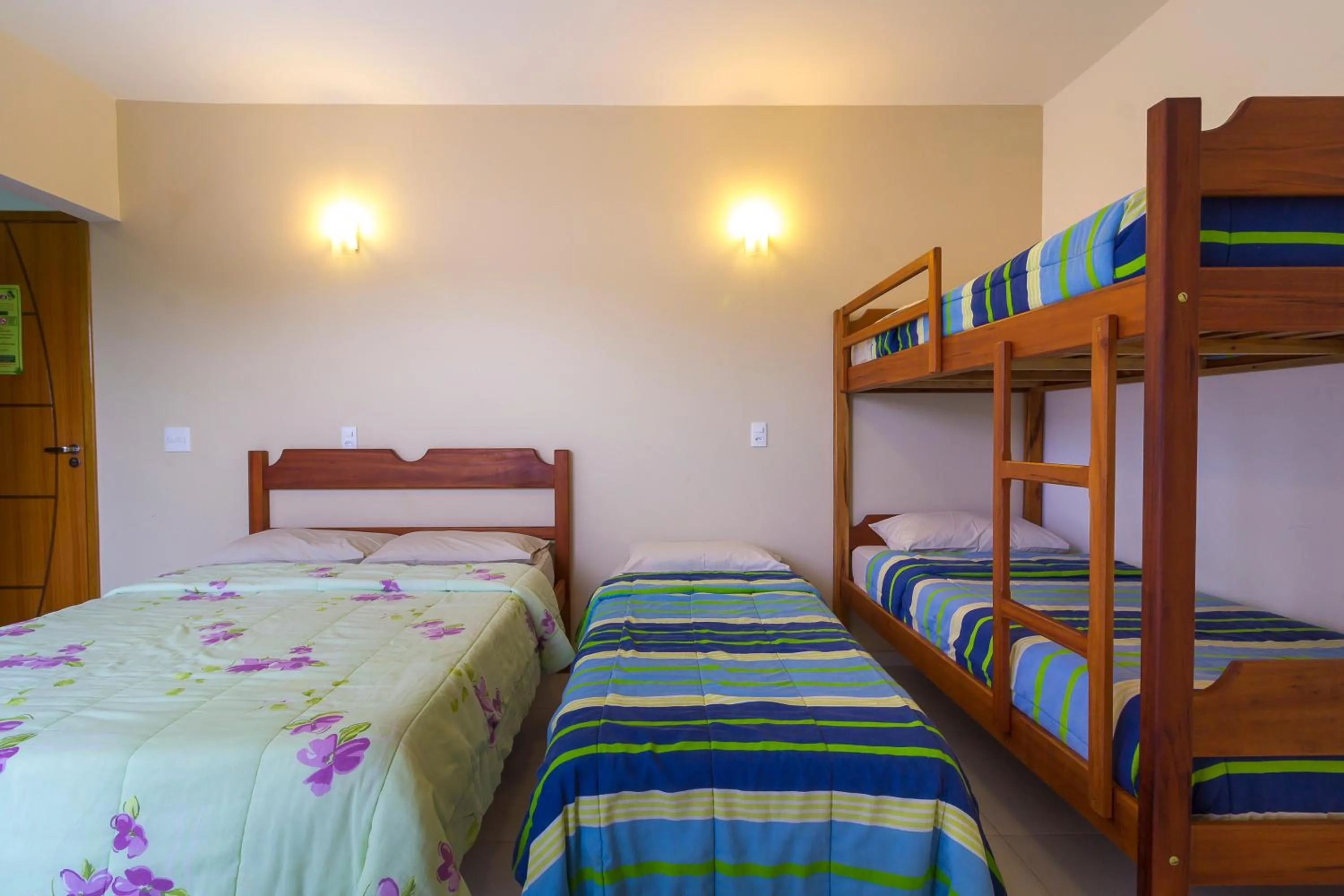 Bed in Pousada Camila